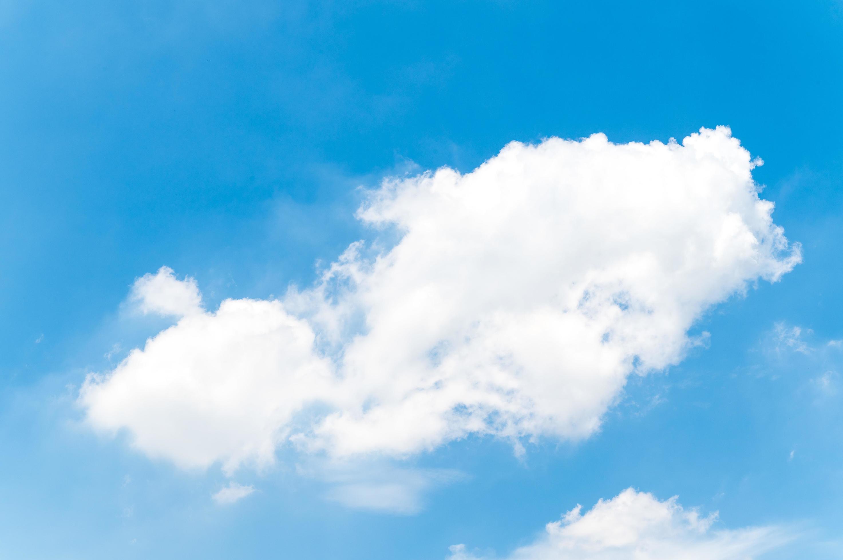 Beautiful white fluffy clouds in blue sky. Nature background from white cloud in sunny day Stock Free