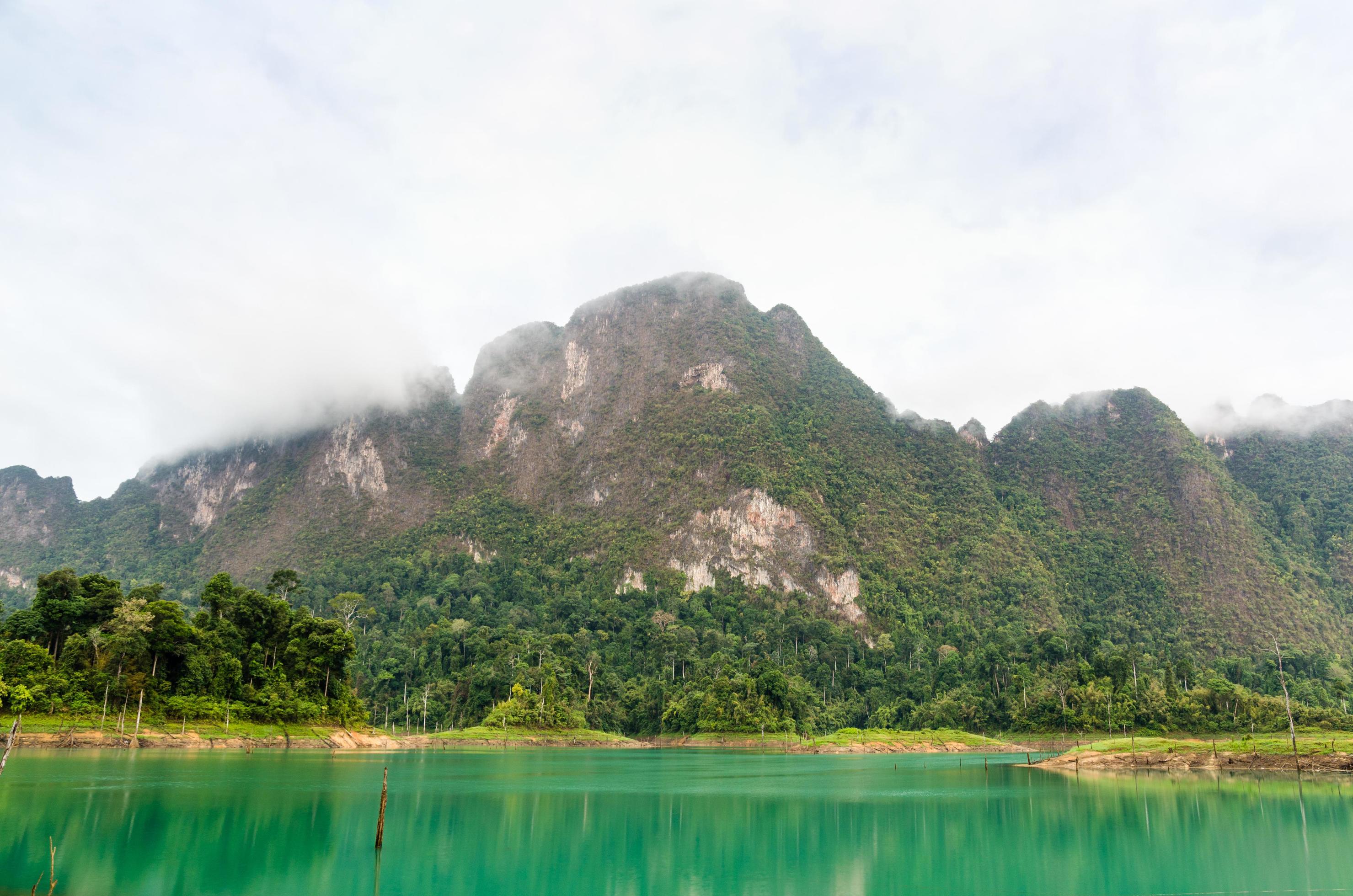 Beautiful high mountains and green lake Stock Free