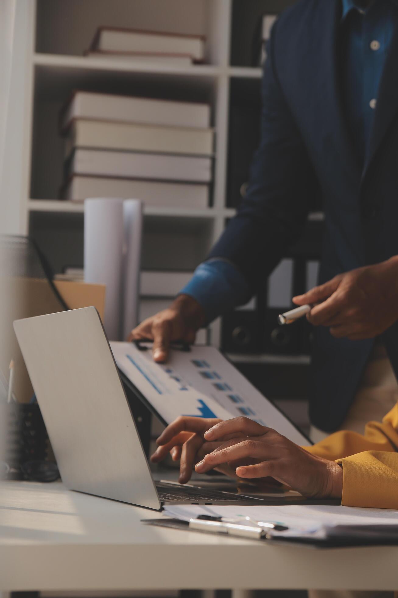 Close up of Business team analyzing income charts and graphs with modern laptop computer. Business analysis and strategy concept. Stock Free