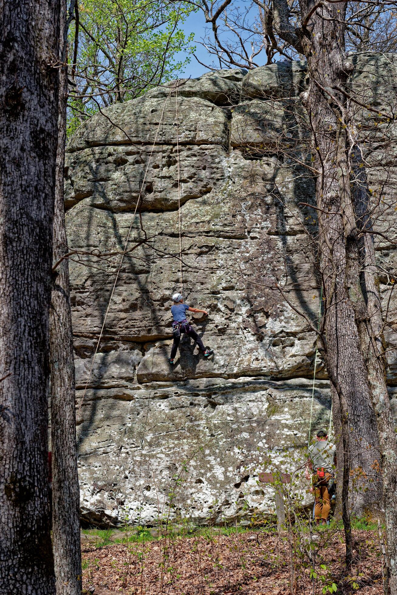 
									Climbing up a boulder vertically Stock Free