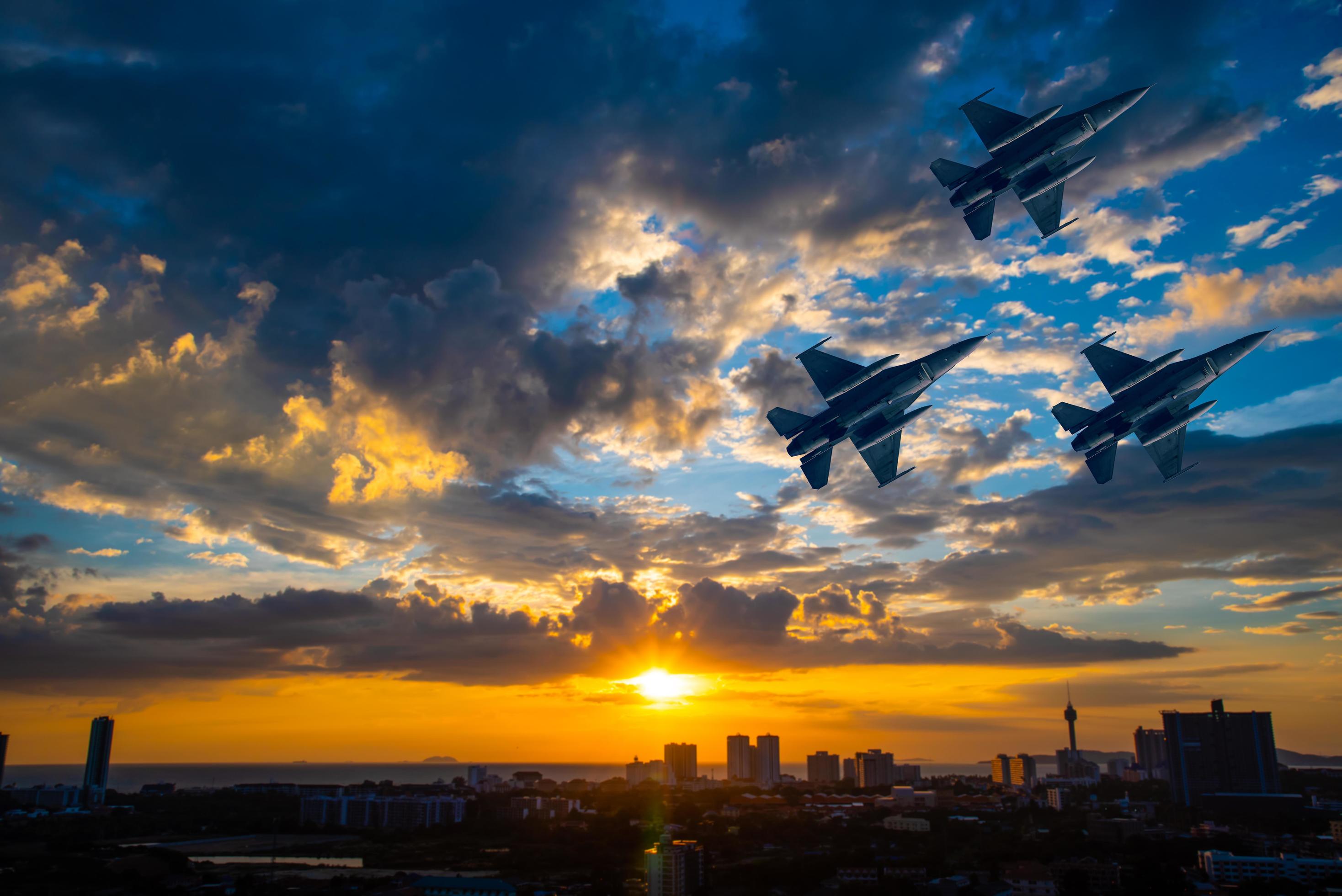 Silhouette airplane with beautiful colorful sunset sky background. Stock Free