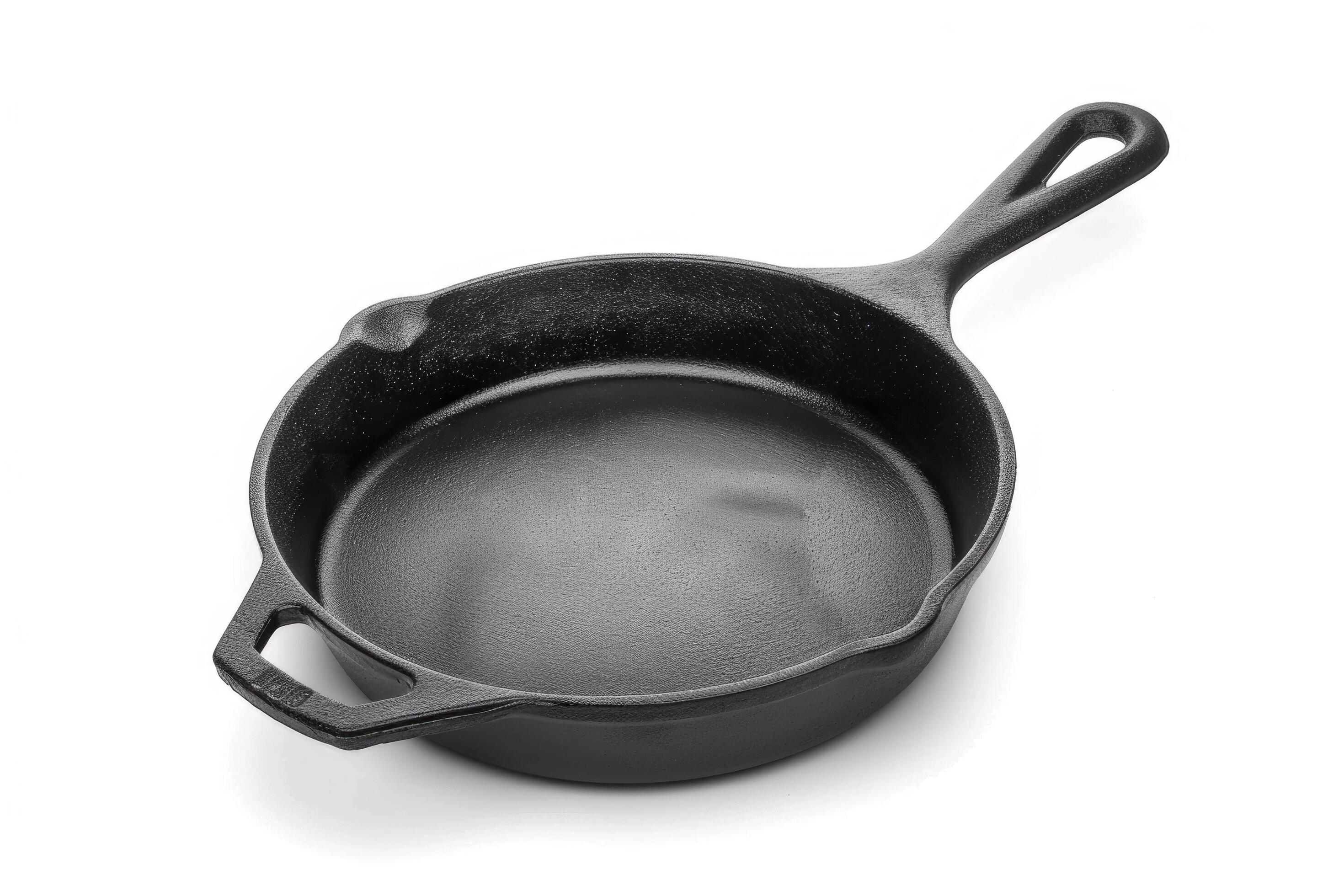 
									Black cast iron skillet on a white background. Stock Free