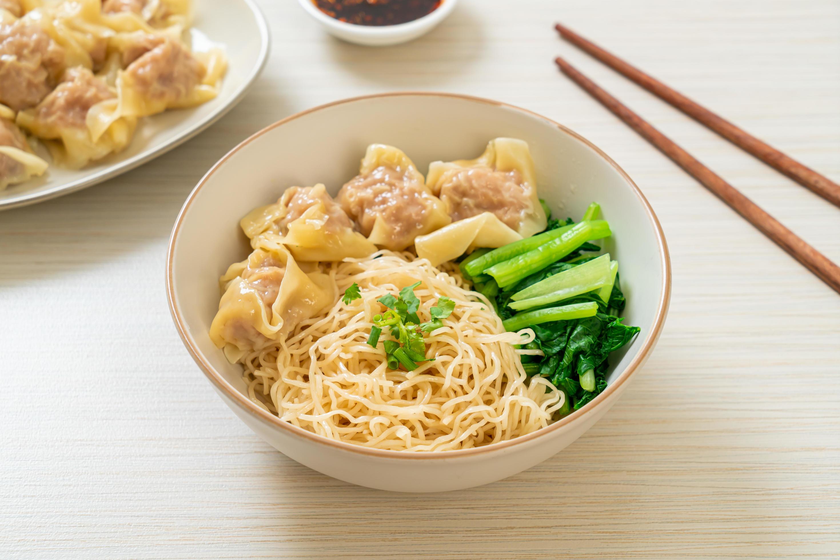 Dried egg noodles with pork wonton or pork dumplings without soup Asian food style Stock Free