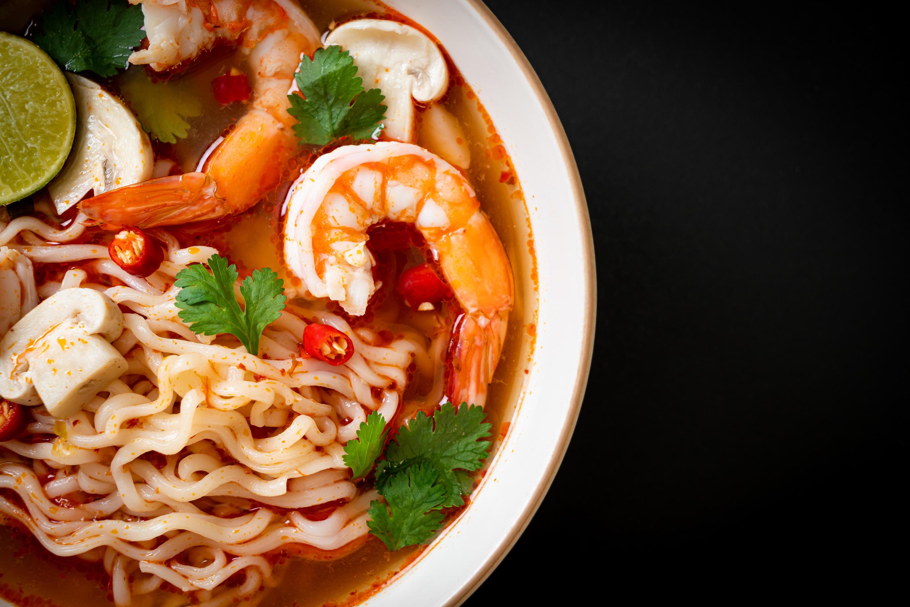 Instant noodles ramen in spicy soup with shrimps, or Tom Yum Kung – Asian food style Stock Free