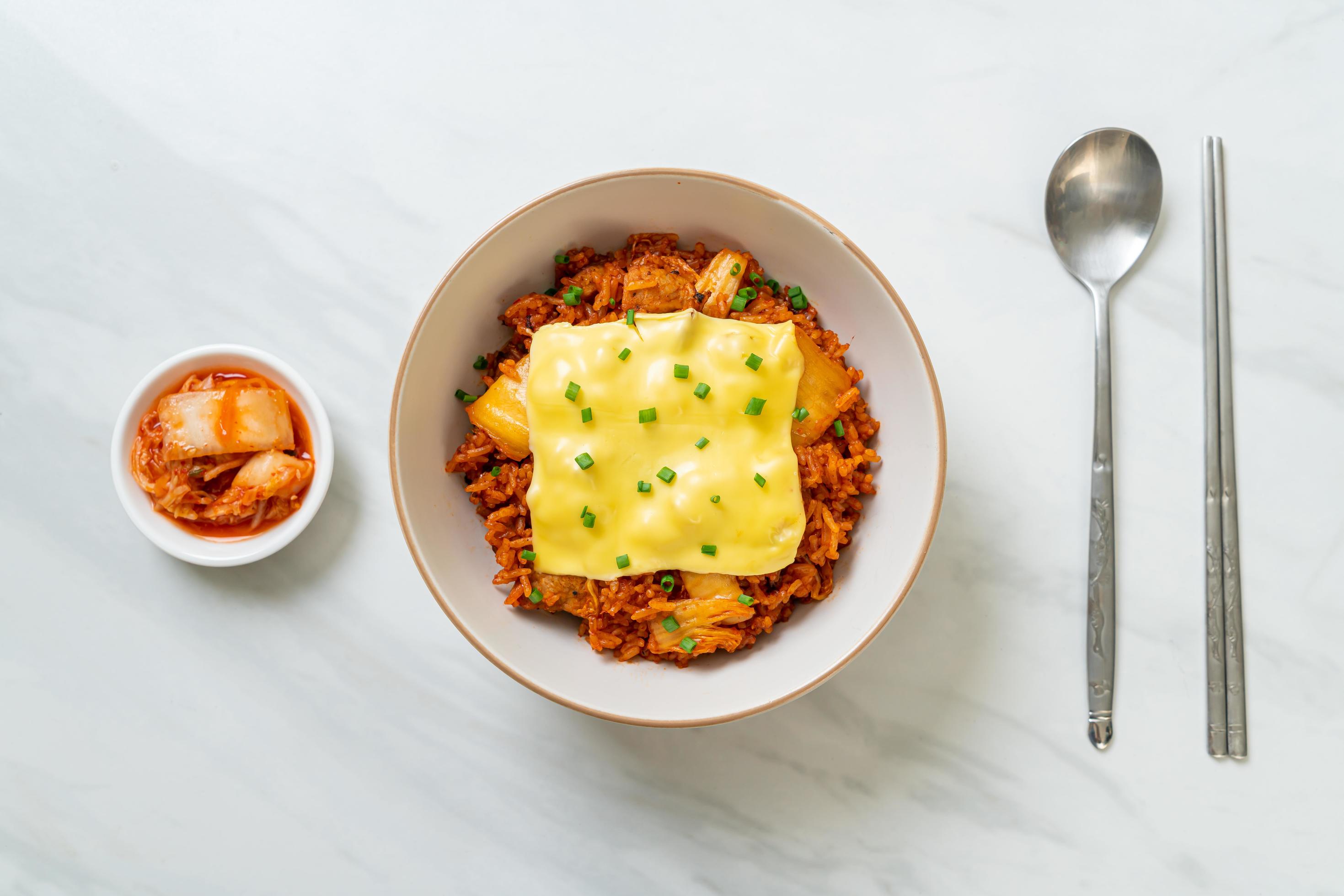 Kimchi fried rice with pork and topped cheese – Asian and fusion food style Stock Free