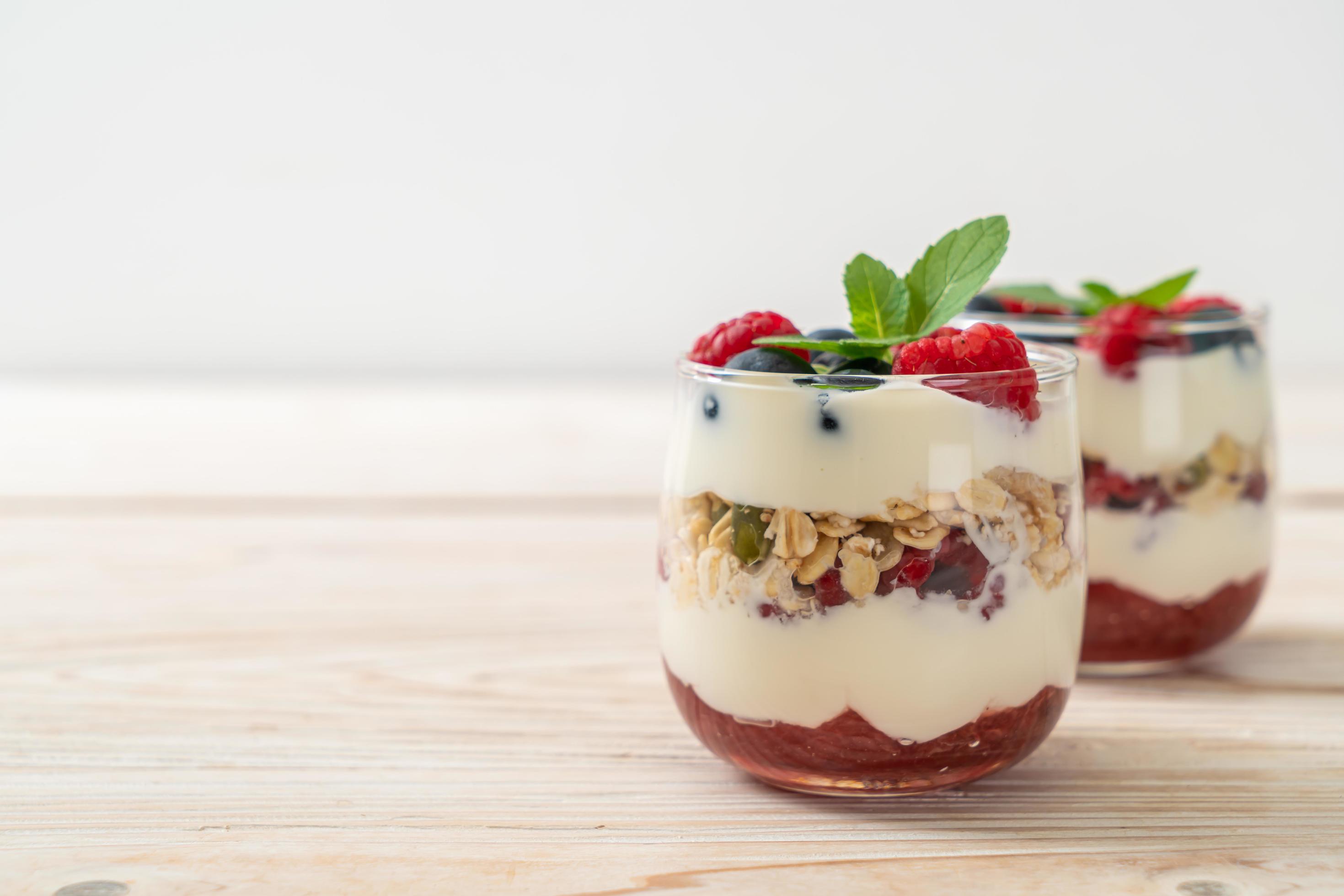 Homemade raspberry and blueberry with yogurt and granola – healthy food style Stock Free