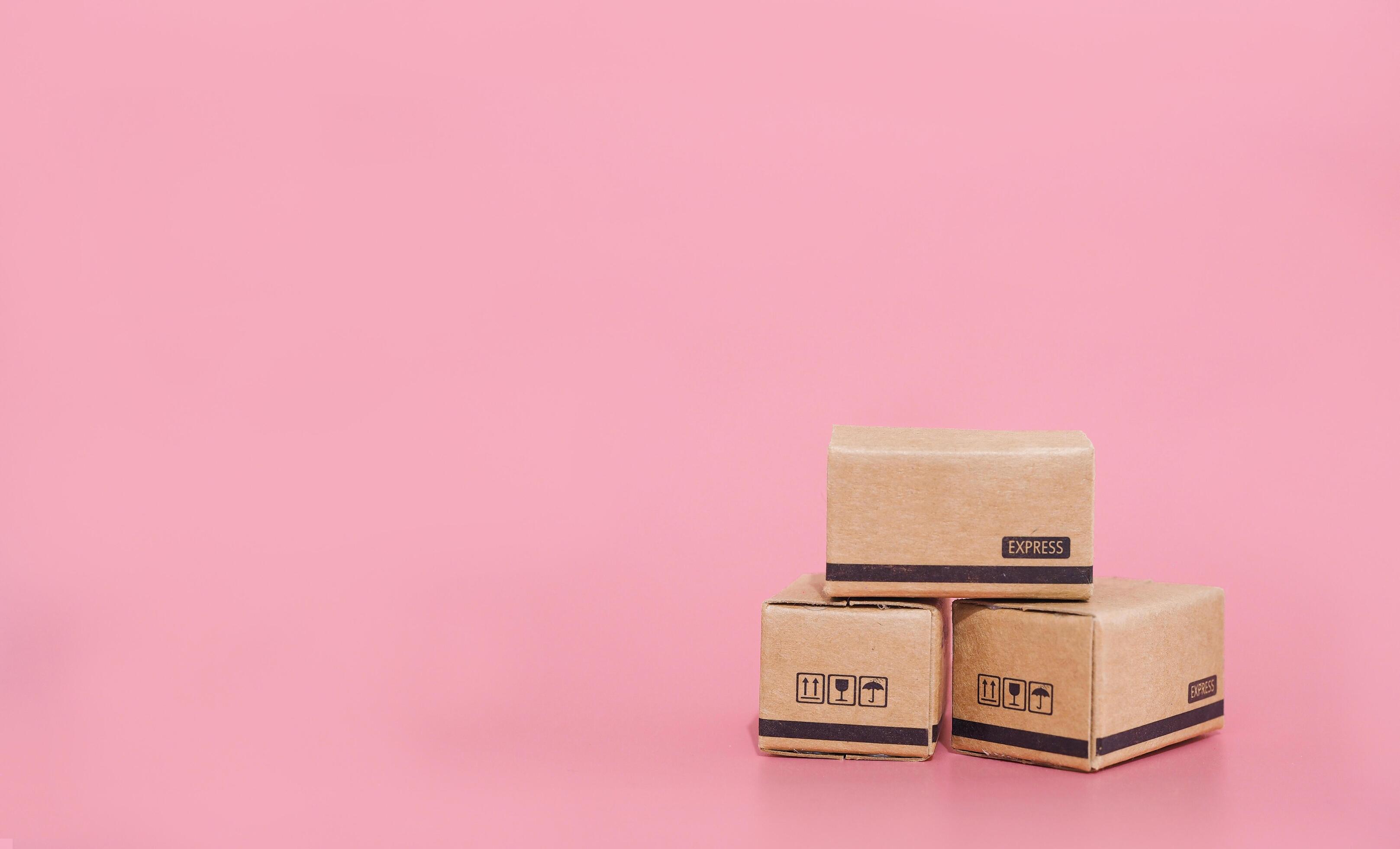 Carton boxes with pink background. The concept about Business E-Commerce and online shopping Stock Free