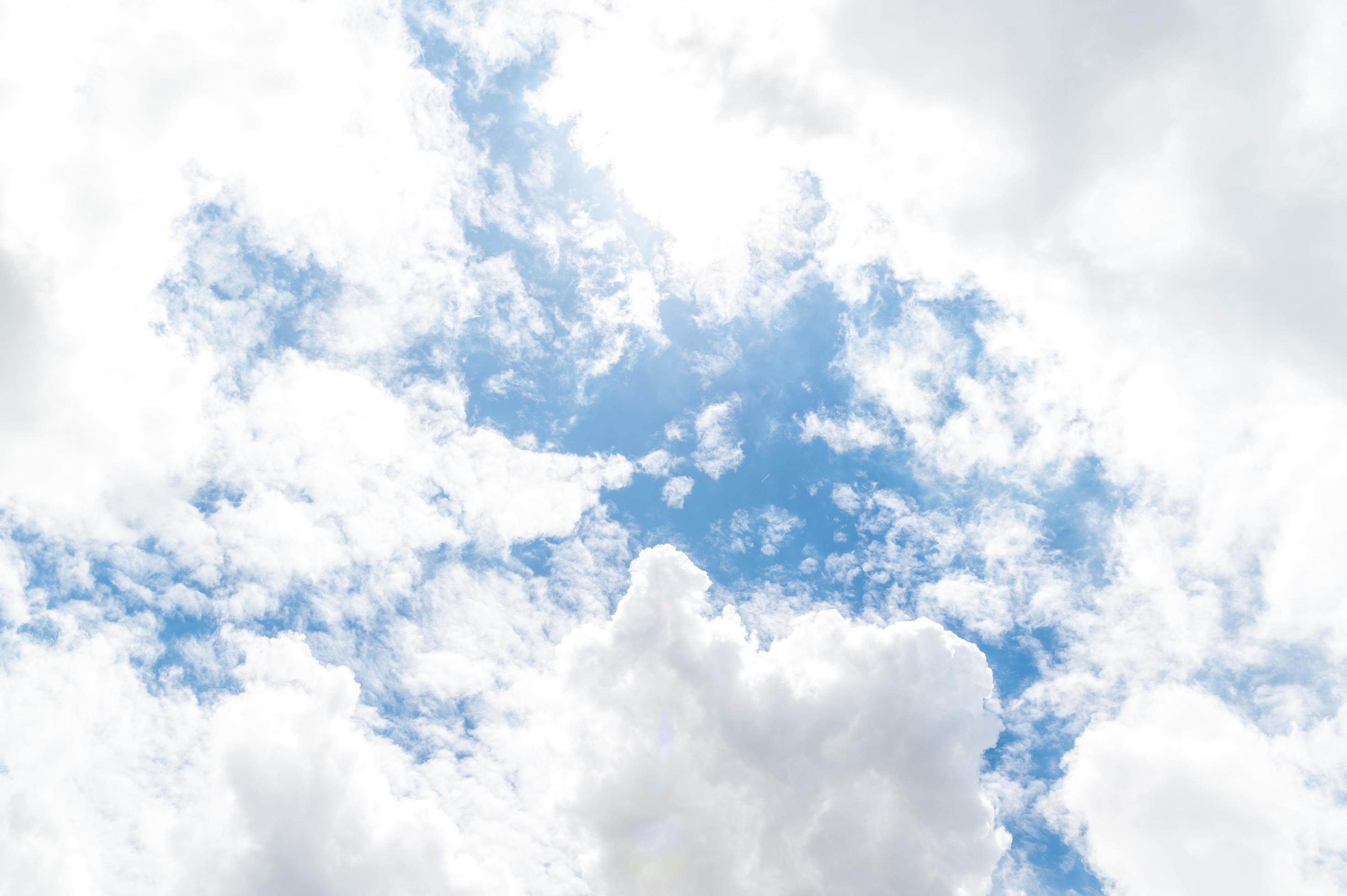 Beautiful white fluffy clouds in blue sky. Nature background from white clouds in sunny day Stock Free