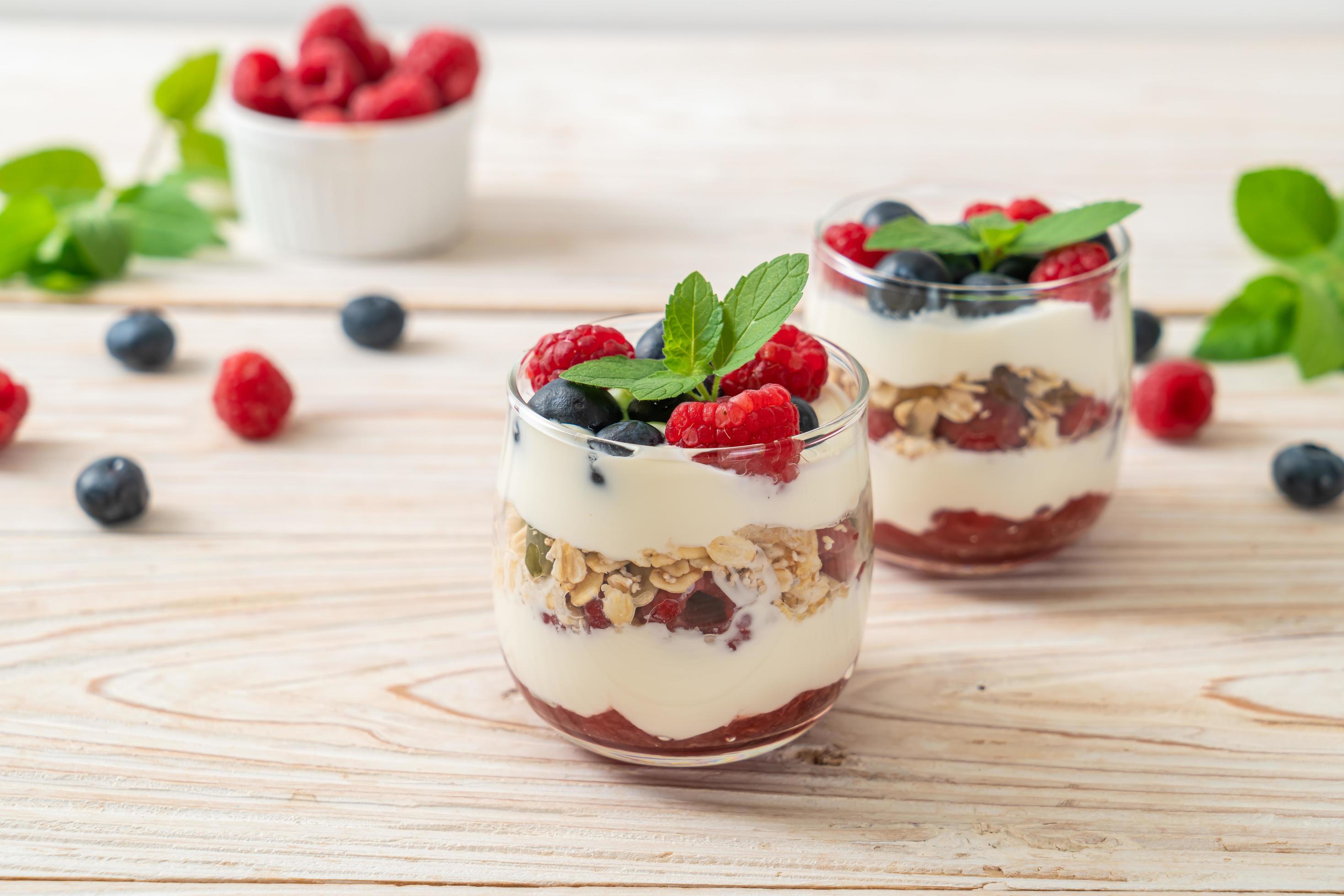 Homemade raspberry and blueberry with yogurt and granola – healthy food style Stock Free