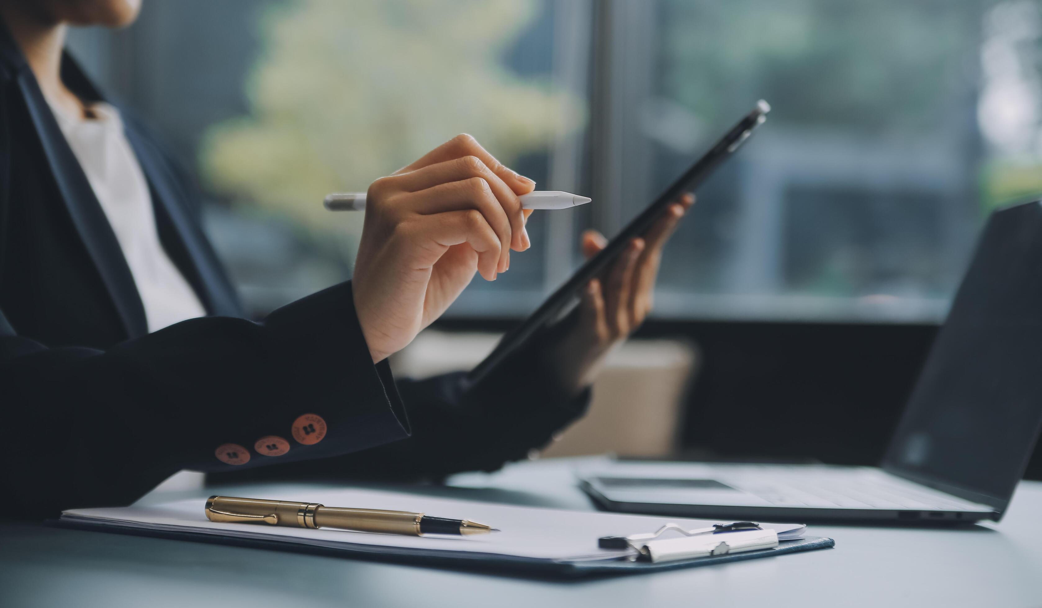 Portrait of a successful business woman using digital tablet Stock Free