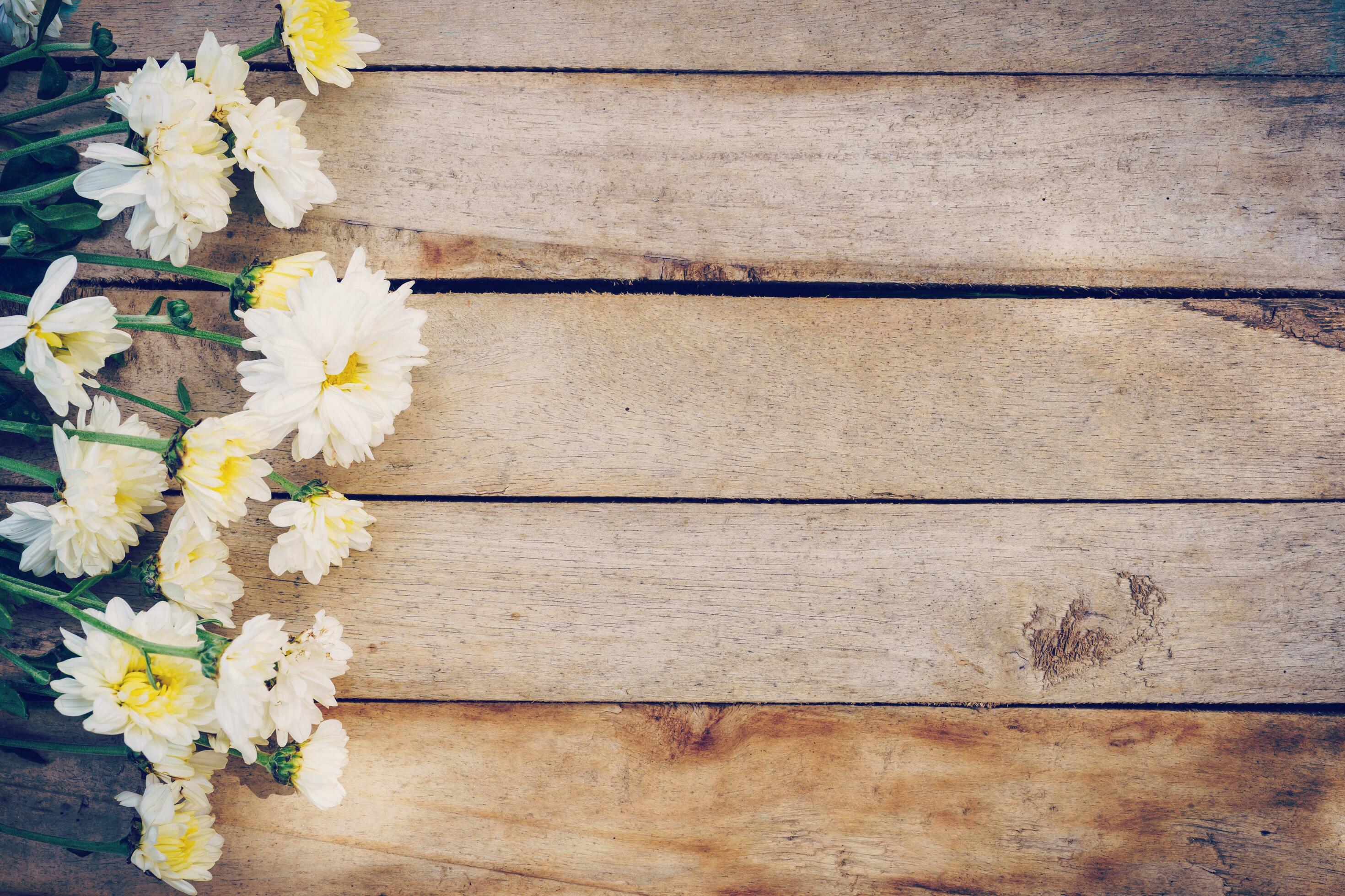 Flowers on old grunge wooden table texture and background with copy space. Stock Free