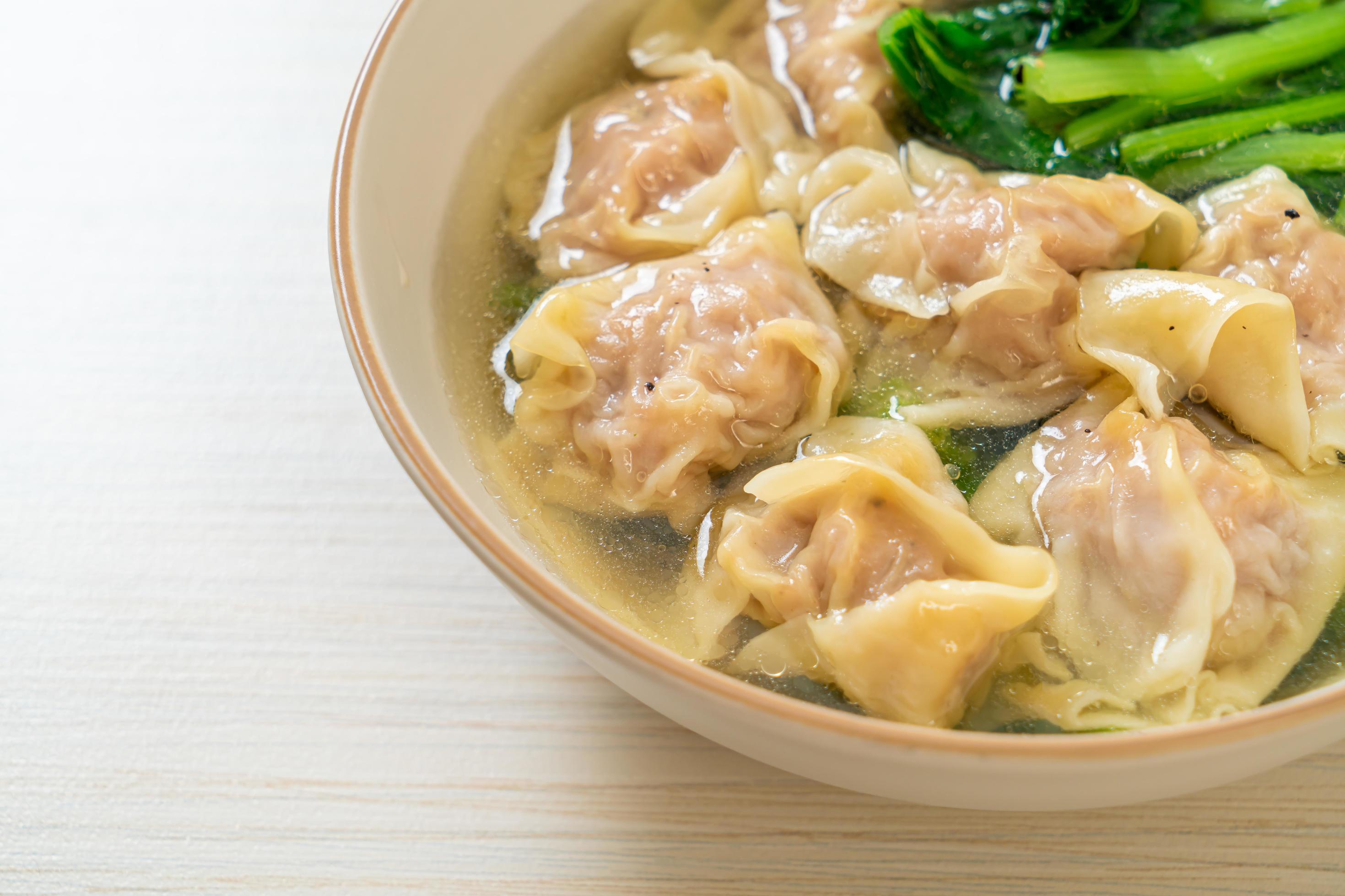 Pork wonton soup or pork dumplings soup with vegetable – Asian food style Stock Free