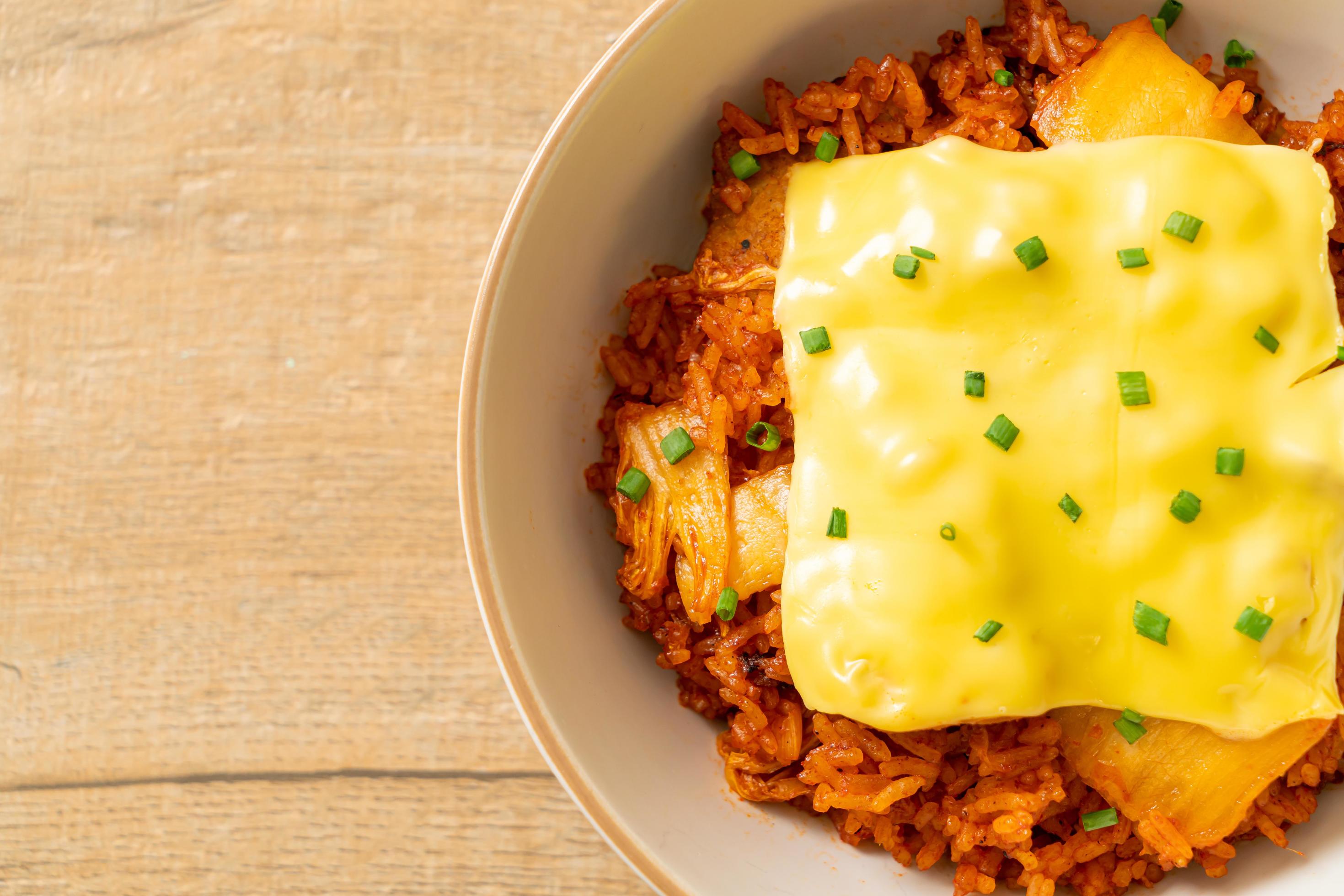 Kimchi fried rice with pork and topped cheese – Asian and fusion food style Stock Free