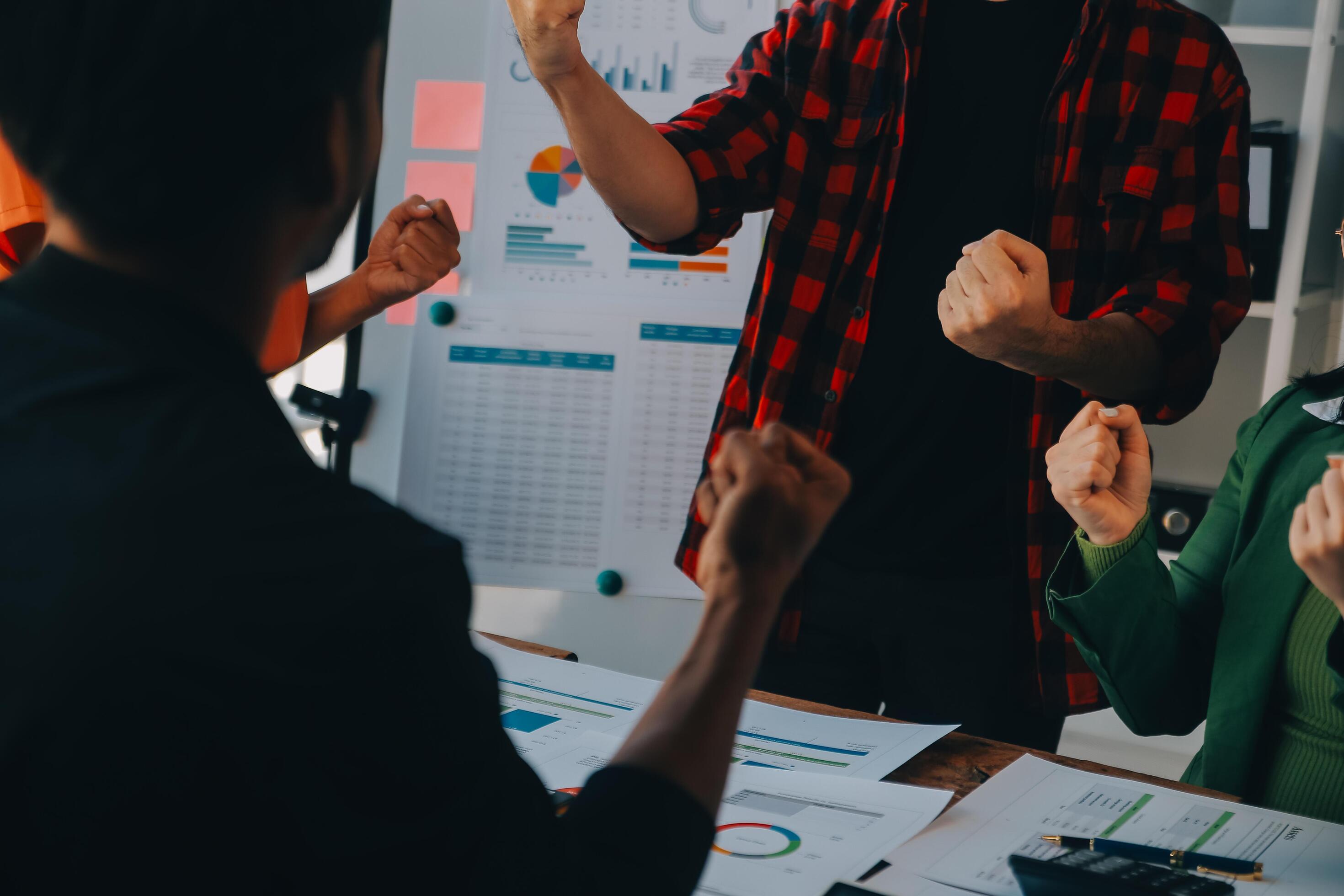 Cheerful business colleagues applauding in meeting at coworking office Stock Free