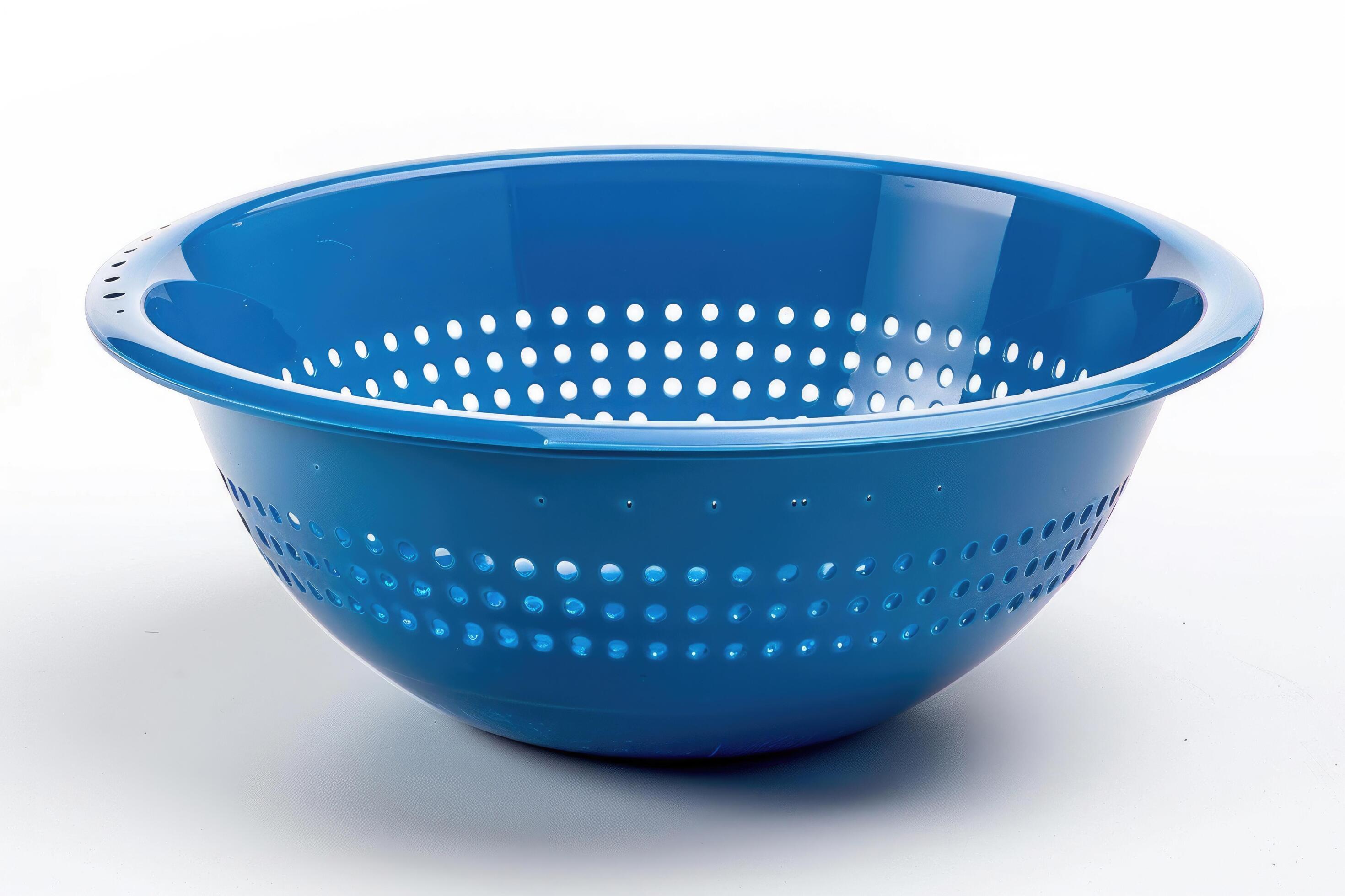 Blue plastic colander on a white background. Stock Free