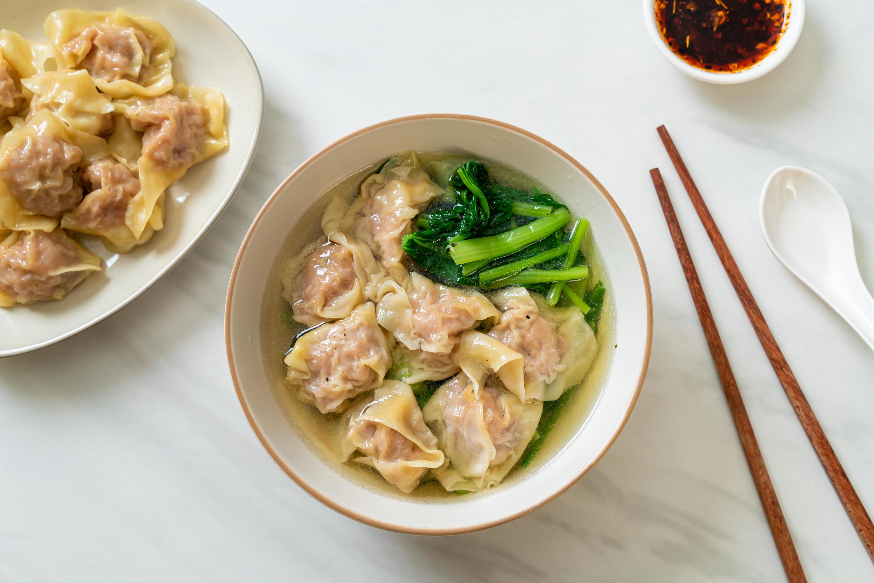 Pork wonton soup or pork dumplings soup with vegetable – Asian food style Stock Free