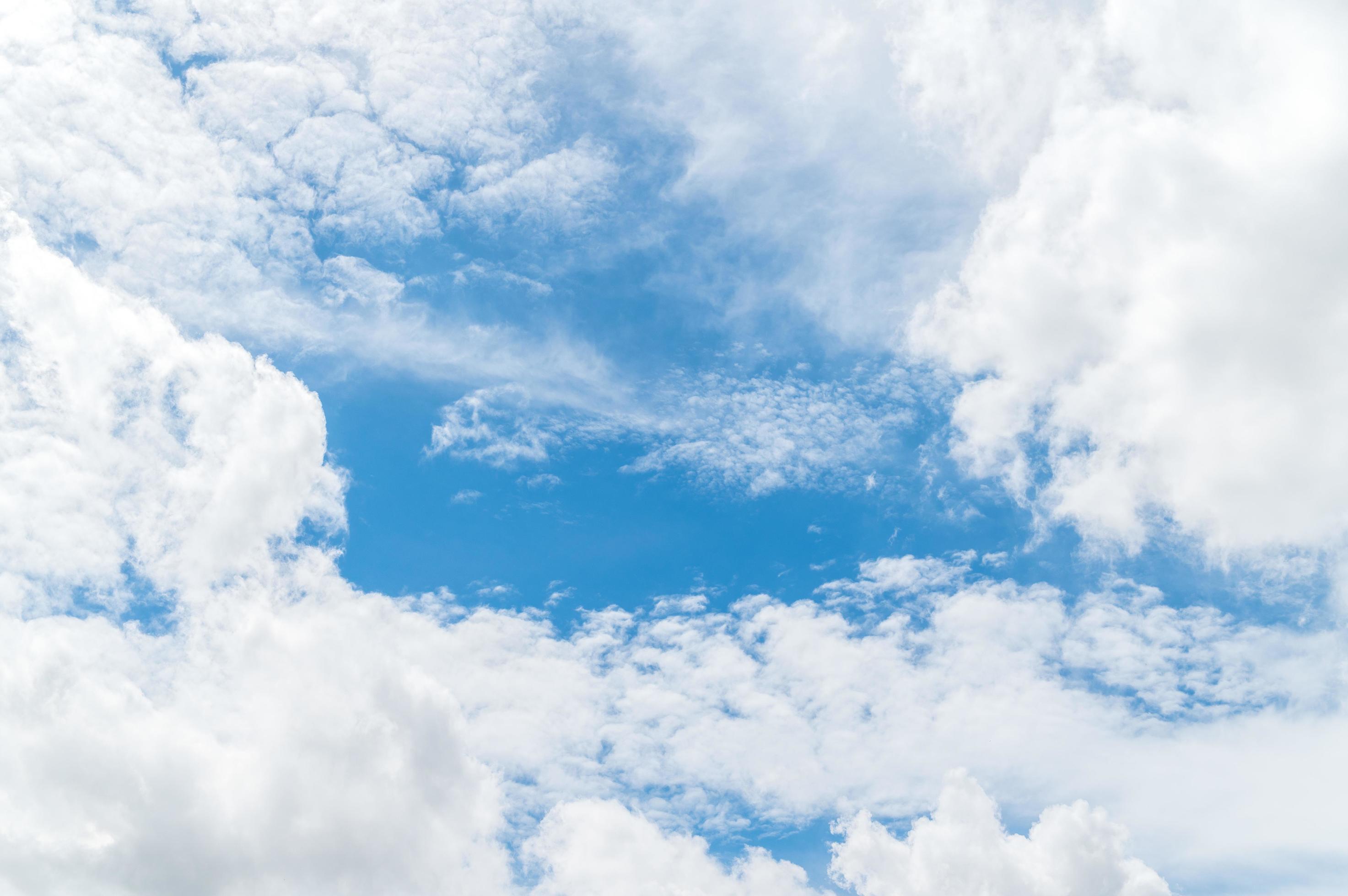 Beautiful white fluffy clouds in blue sky. Nature background from white clouds in sunny day Stock Free