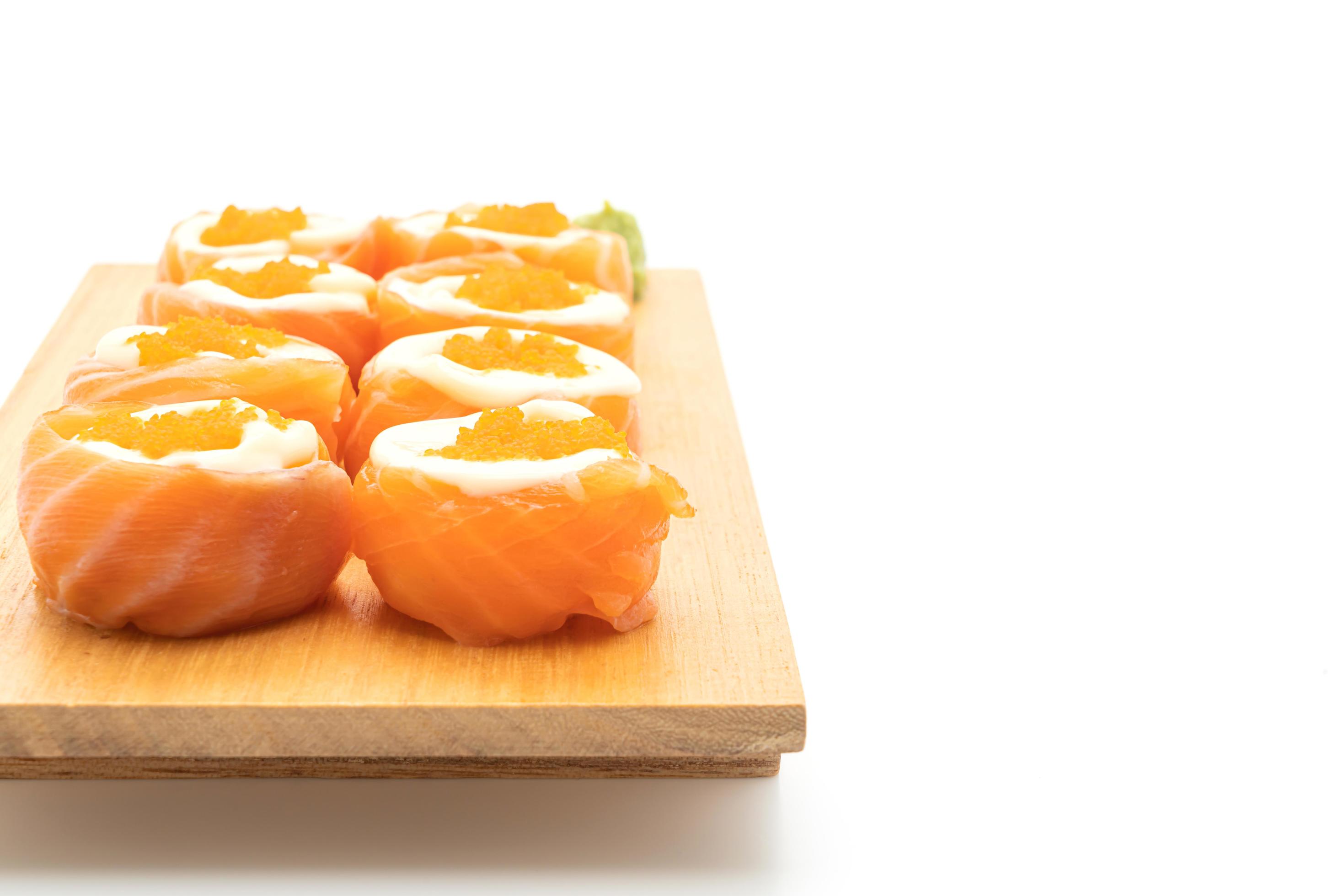 Fresh salmon sushi roll with mayonnaise and shrimp egg – Japanese food style Stock Free