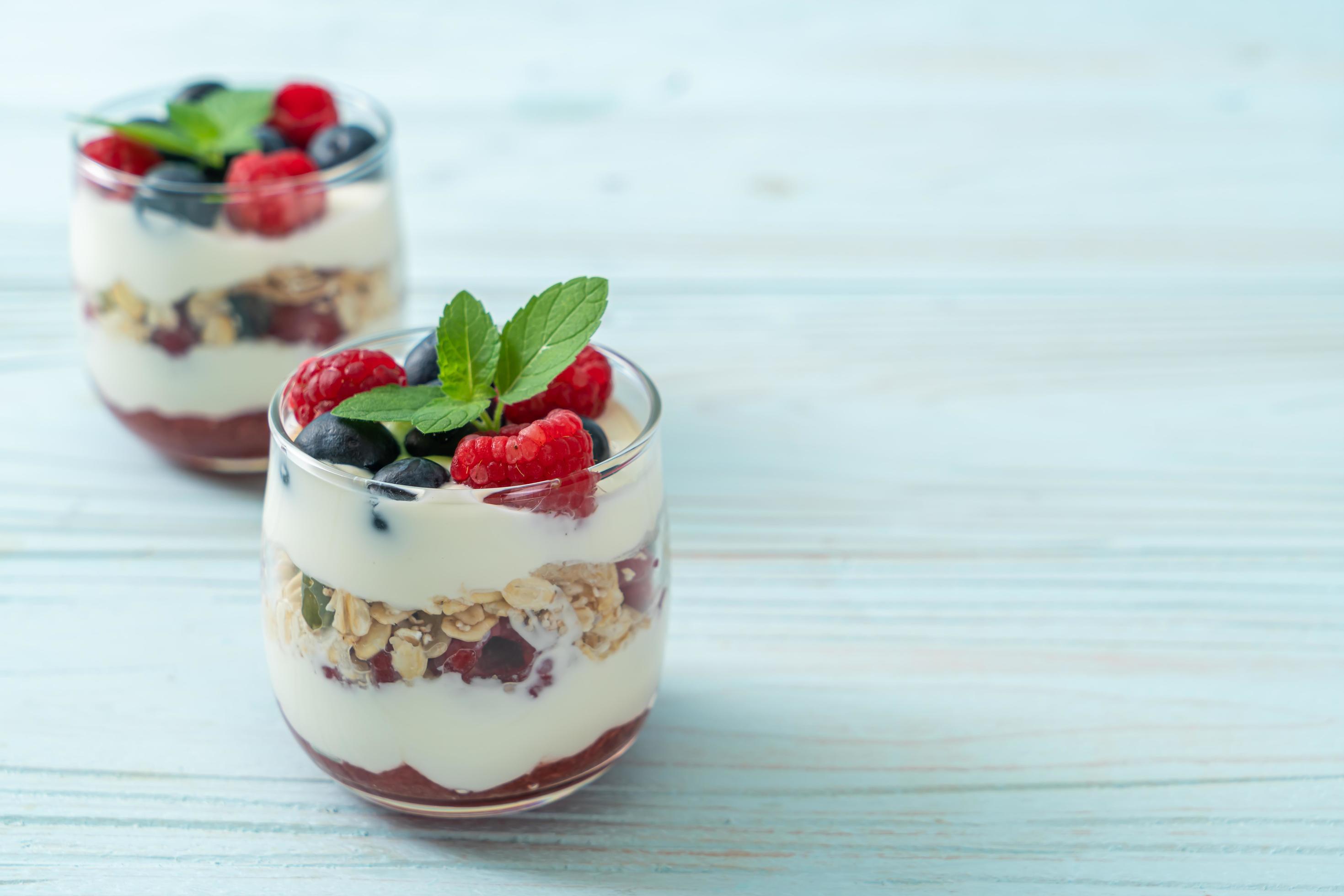 Homemade raspberry and blueberry with yogurt and granola – healthy food style Stock Free