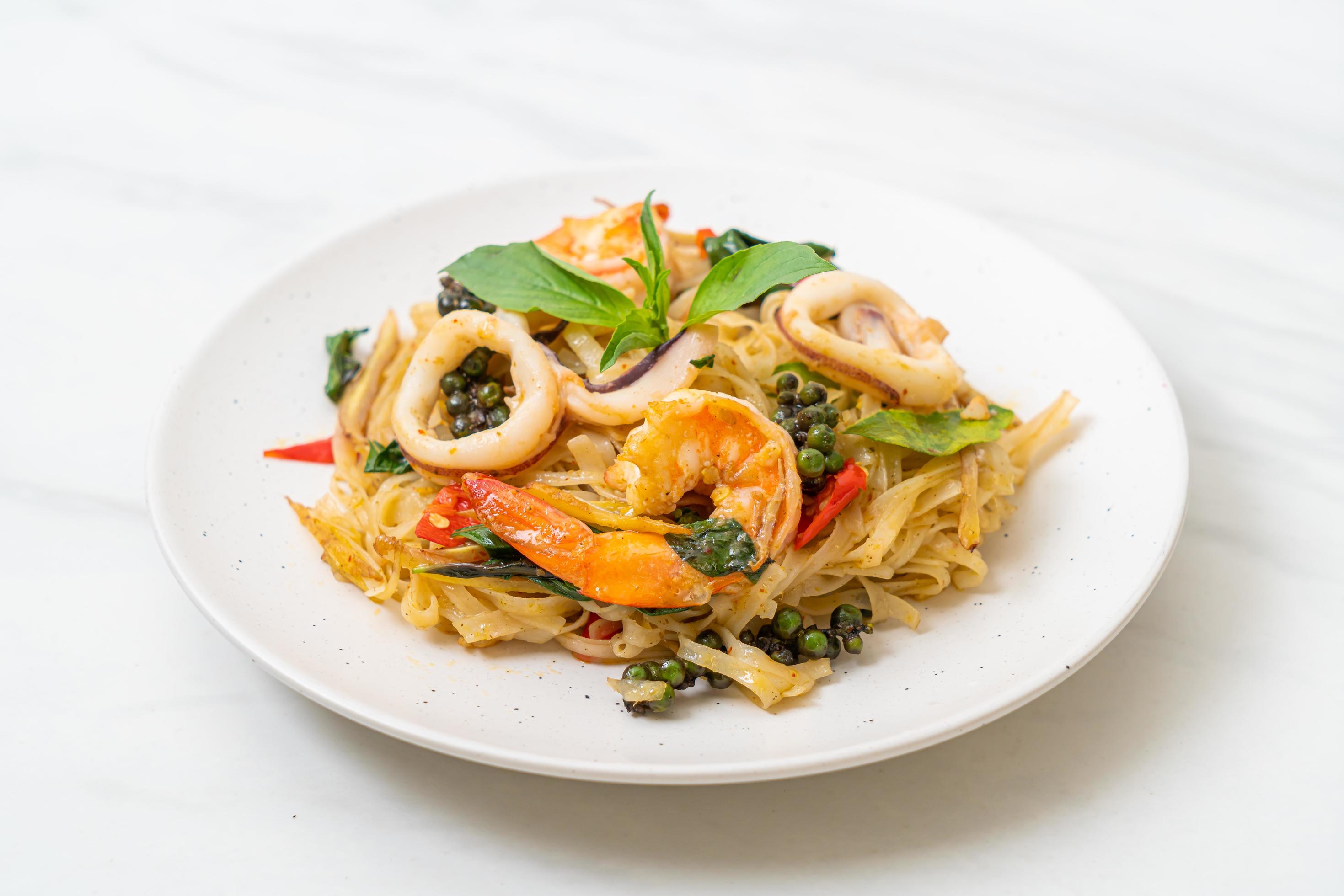 Stir-fried spicy noodles with sea food, or Pad Cha Talay – Thai food style Stock Free