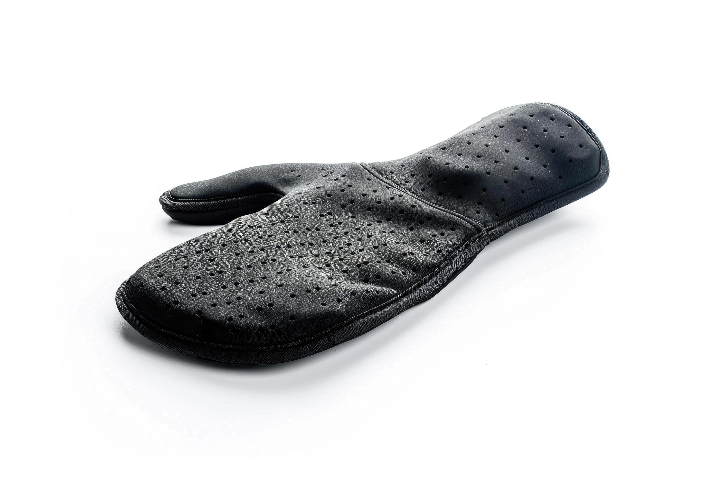 Black silicone oven mitt on a white background. Stock Free