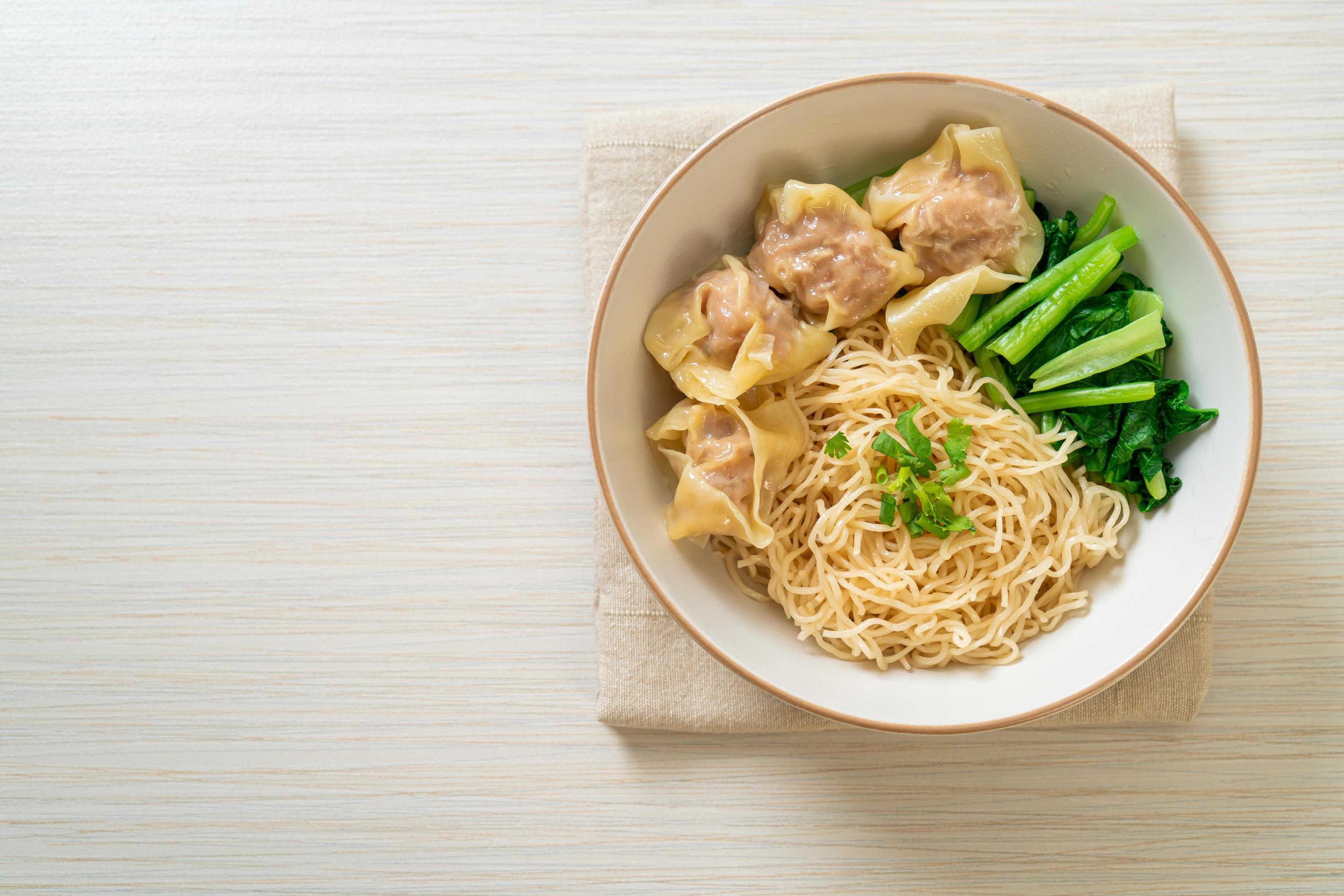 Dried egg noodles with pork wonton or pork dumplings without soup Asian food style Stock Free