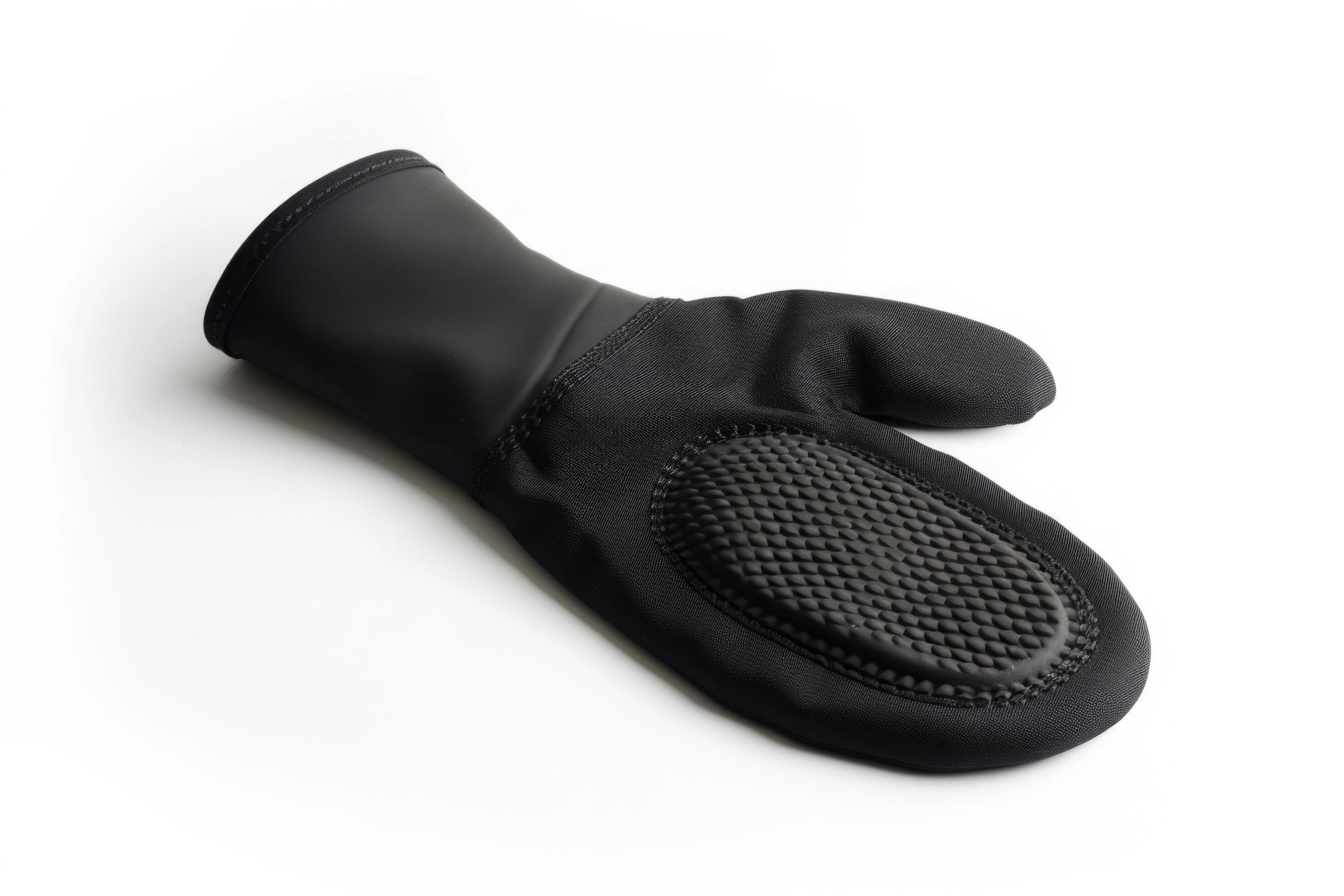 Black silicone oven mitt on a white background. Stock Free