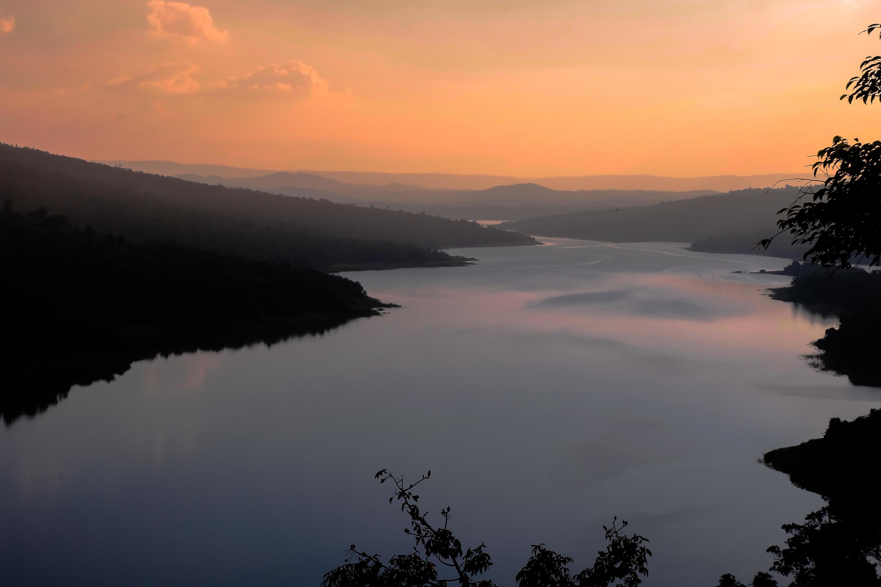 Beautiful sunset landscape of mountain and river in nature. Stock Free