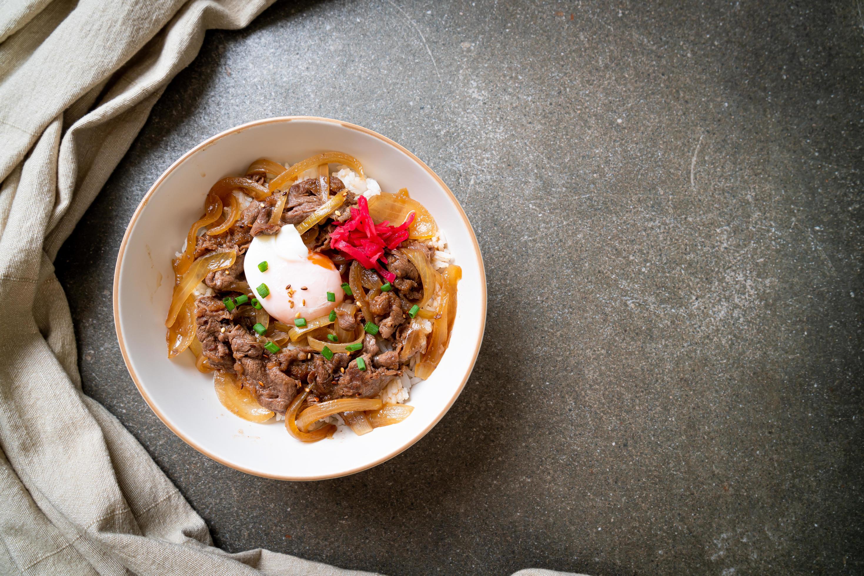 Beef sliced on topped rice with egg, or gyudon – Japanese food style Stock Free