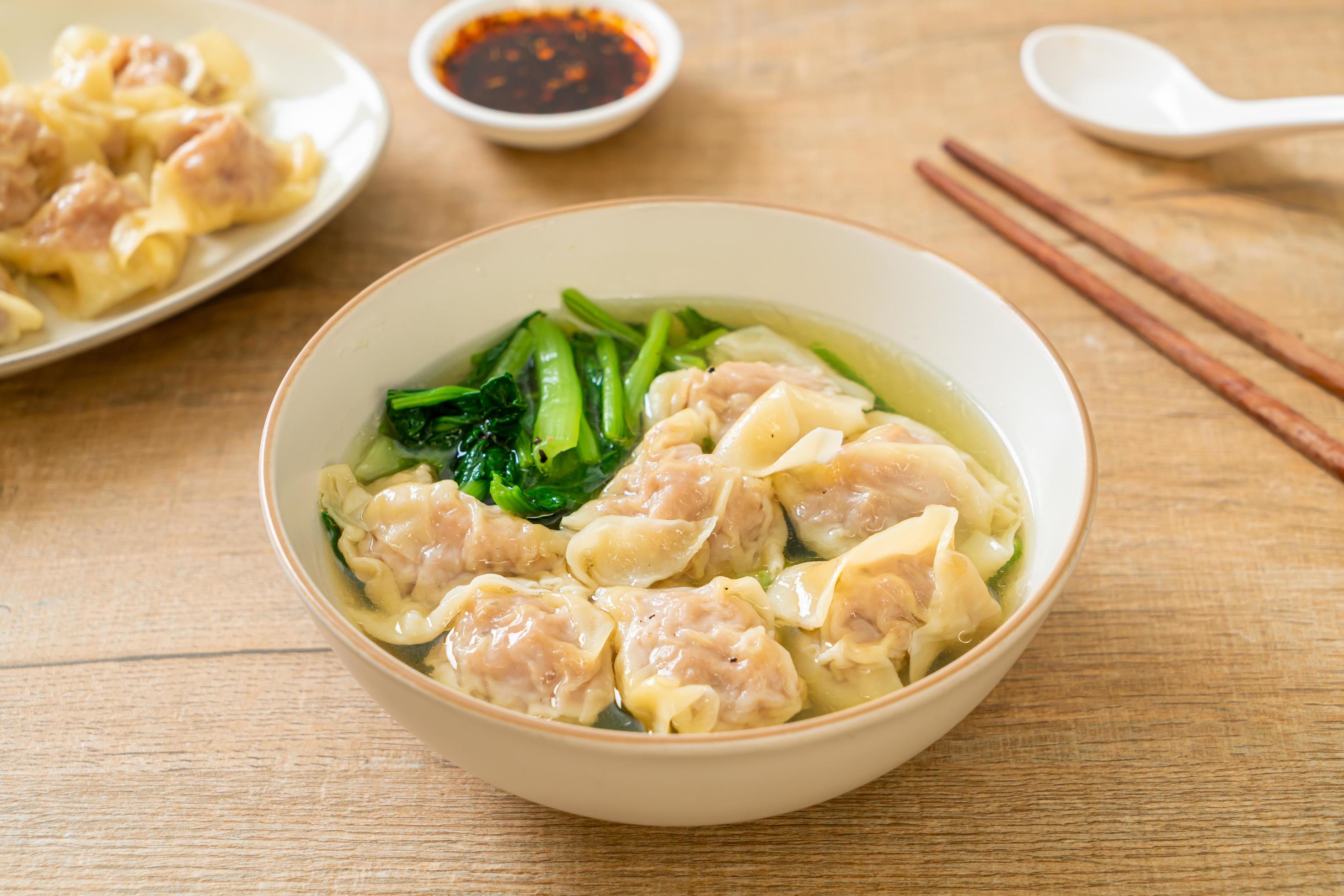 Pork wonton soup or pork dumplings soup with vegetable – Asian food style Stock Free