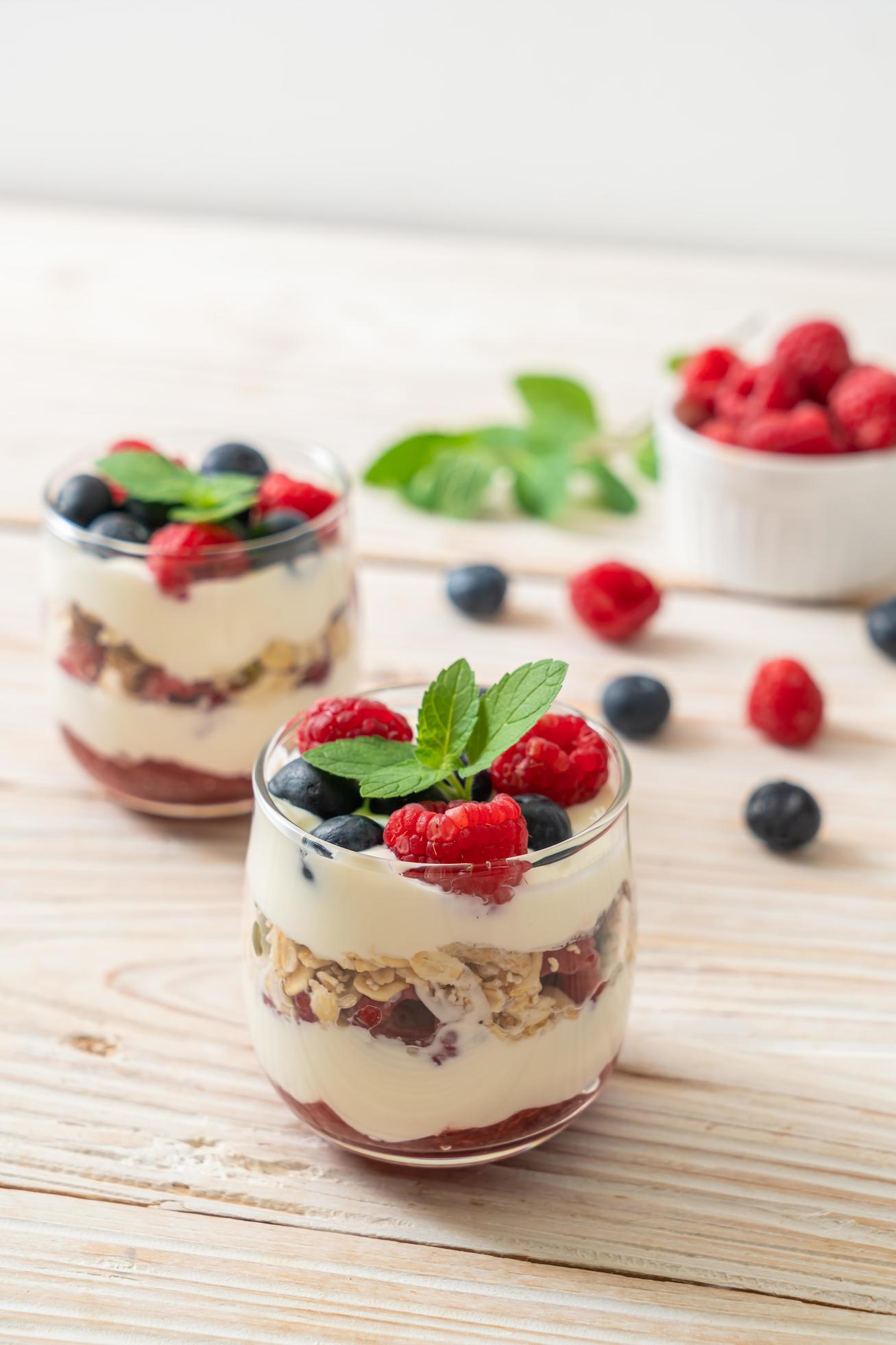 Homemade raspberry and blueberry with yogurt and granola – healthy food style Stock Free