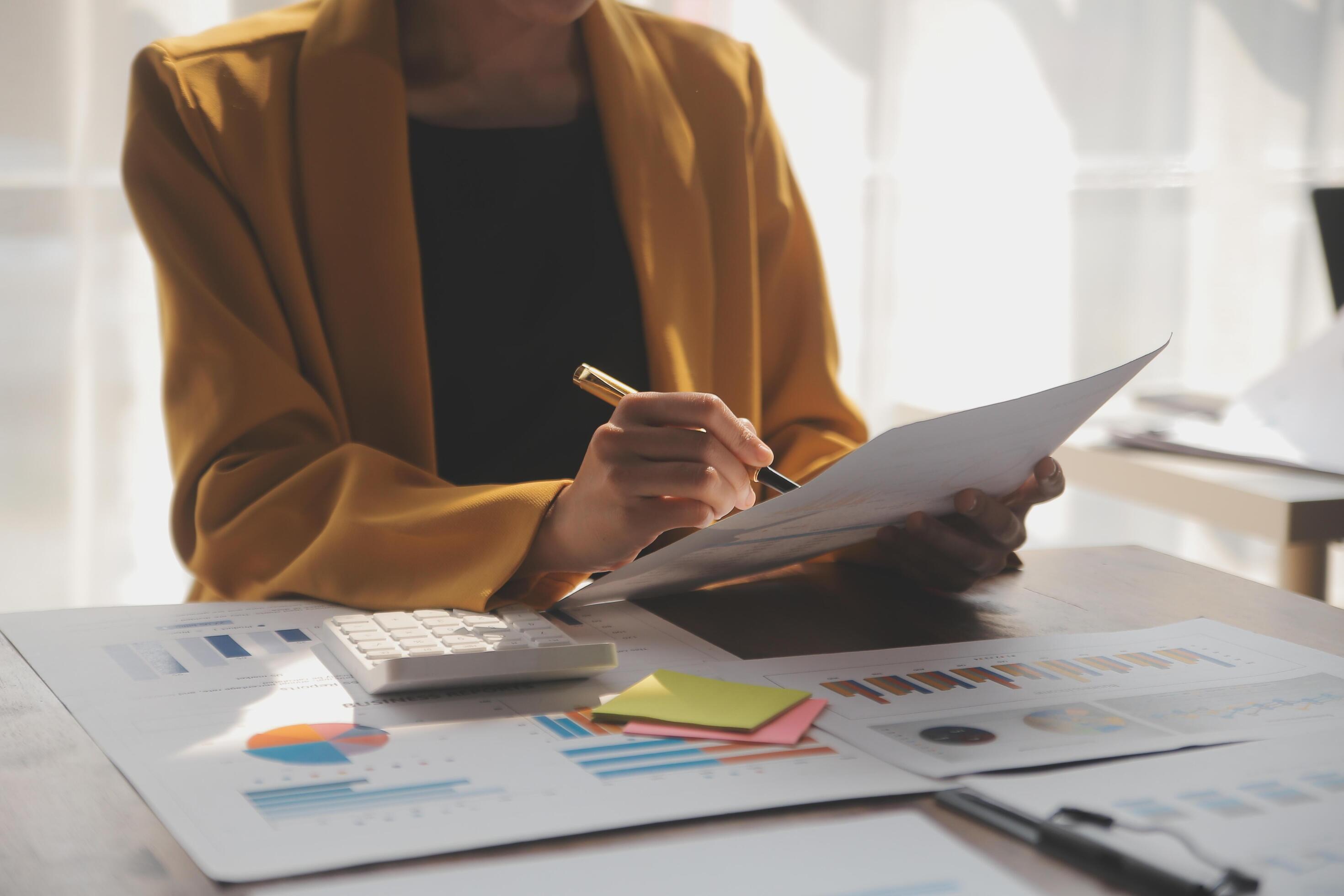 Close up of Business team analyzing income charts and graphs with modern laptop computer. Business analysis and strategy concept. Stock Free