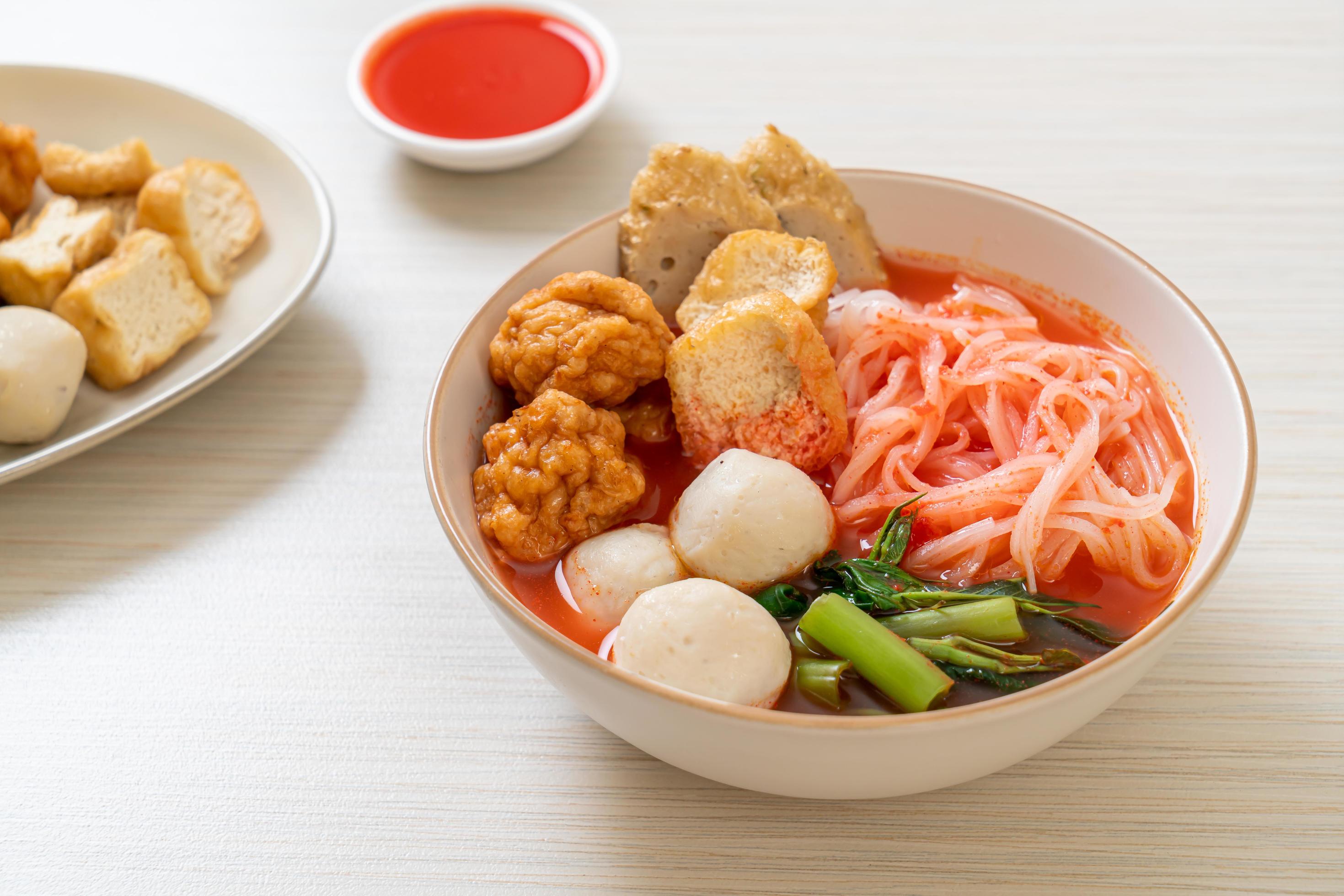 Small flat rice noodles with fish balls and shrimp balls in pink soup, Yen Ta Four or Yen Ta Fo – Asian food style Stock Free