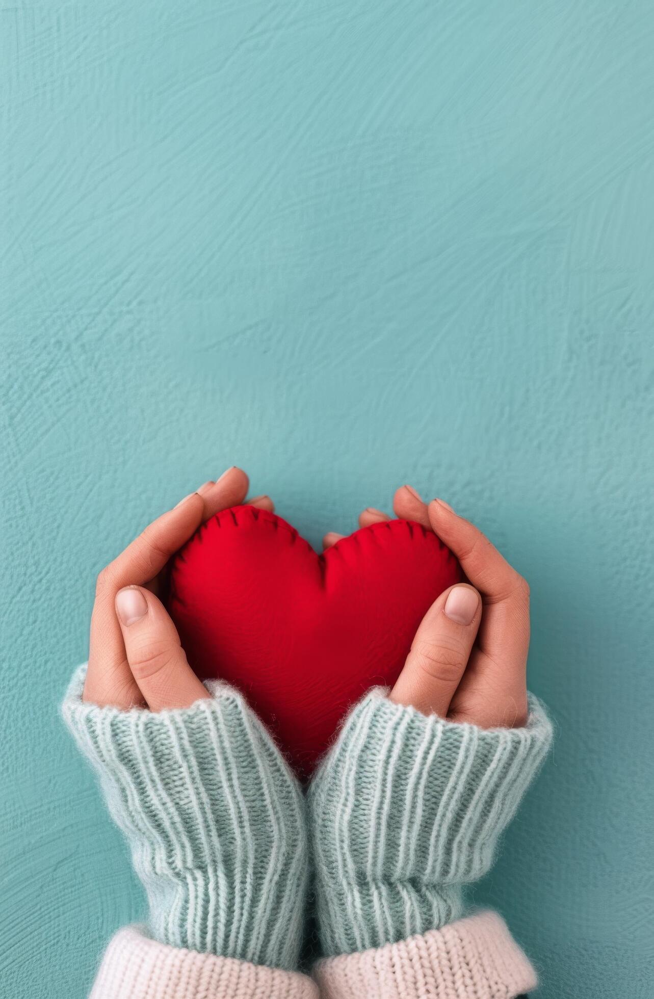 Hands Holding Red Heart on Blue Background Stock Free