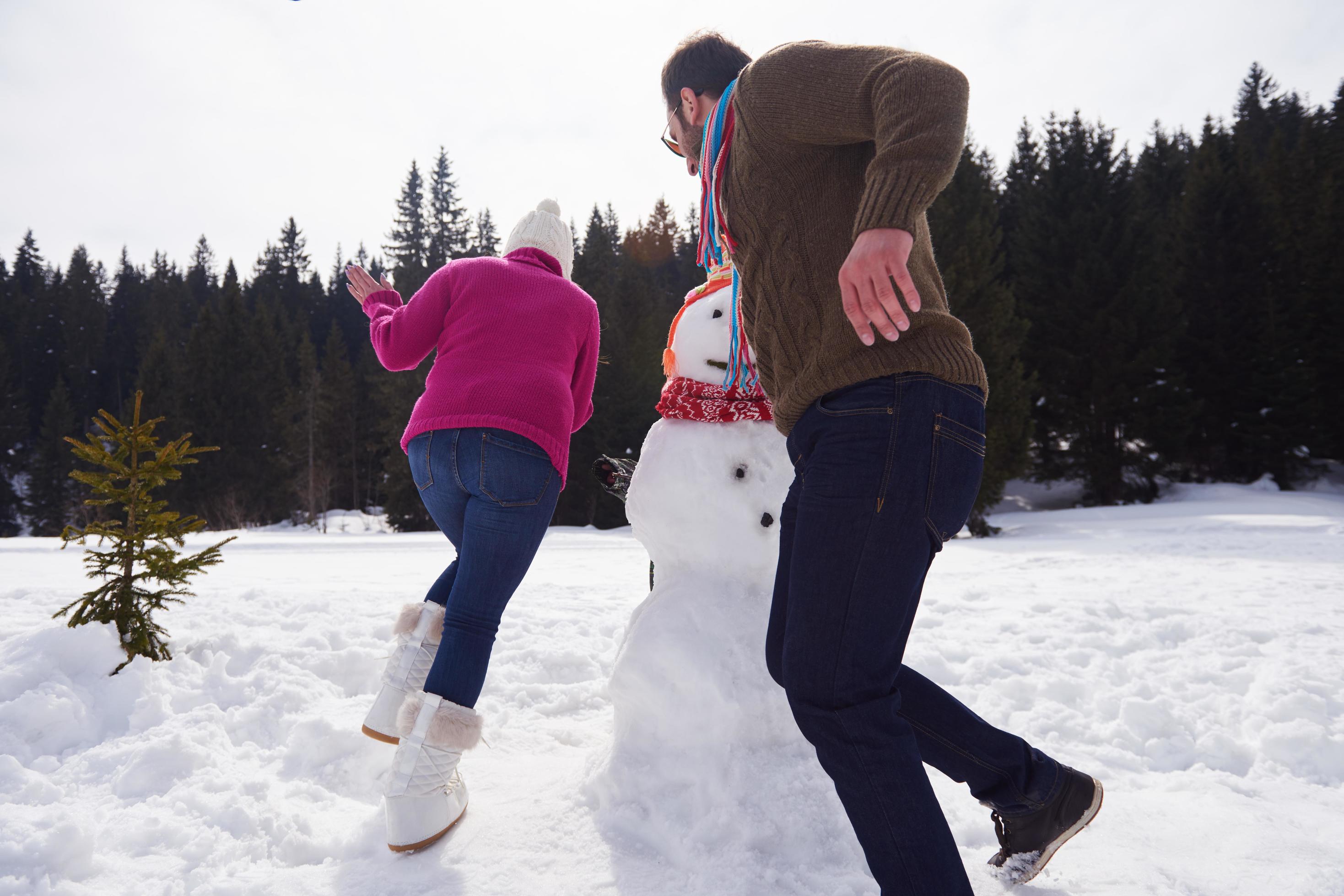 happy family building snowman Stock Free