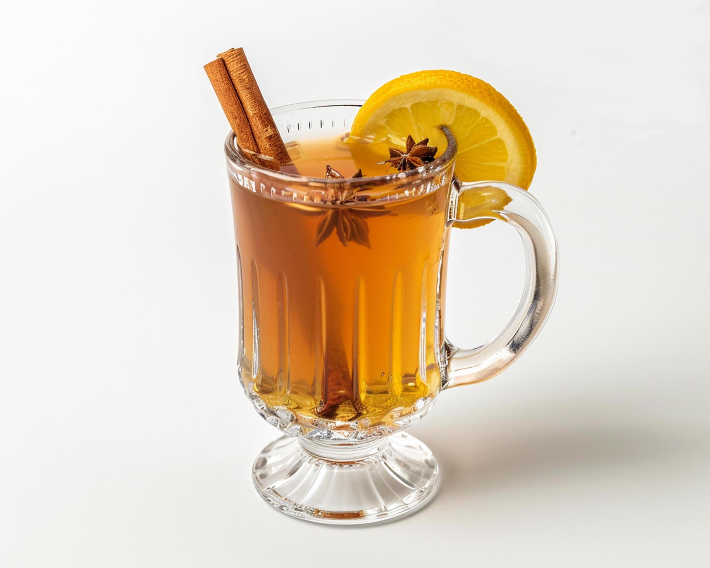 a glass of hot tea with cinnamon and lemon Stock Free