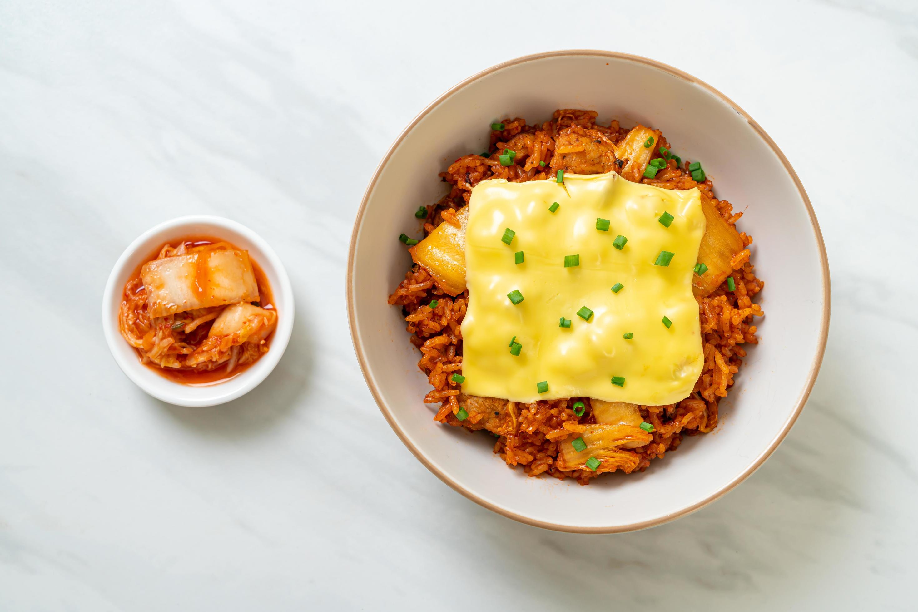 Kimchi fried rice with pork and topped cheese – Asian and fusion food style Stock Free