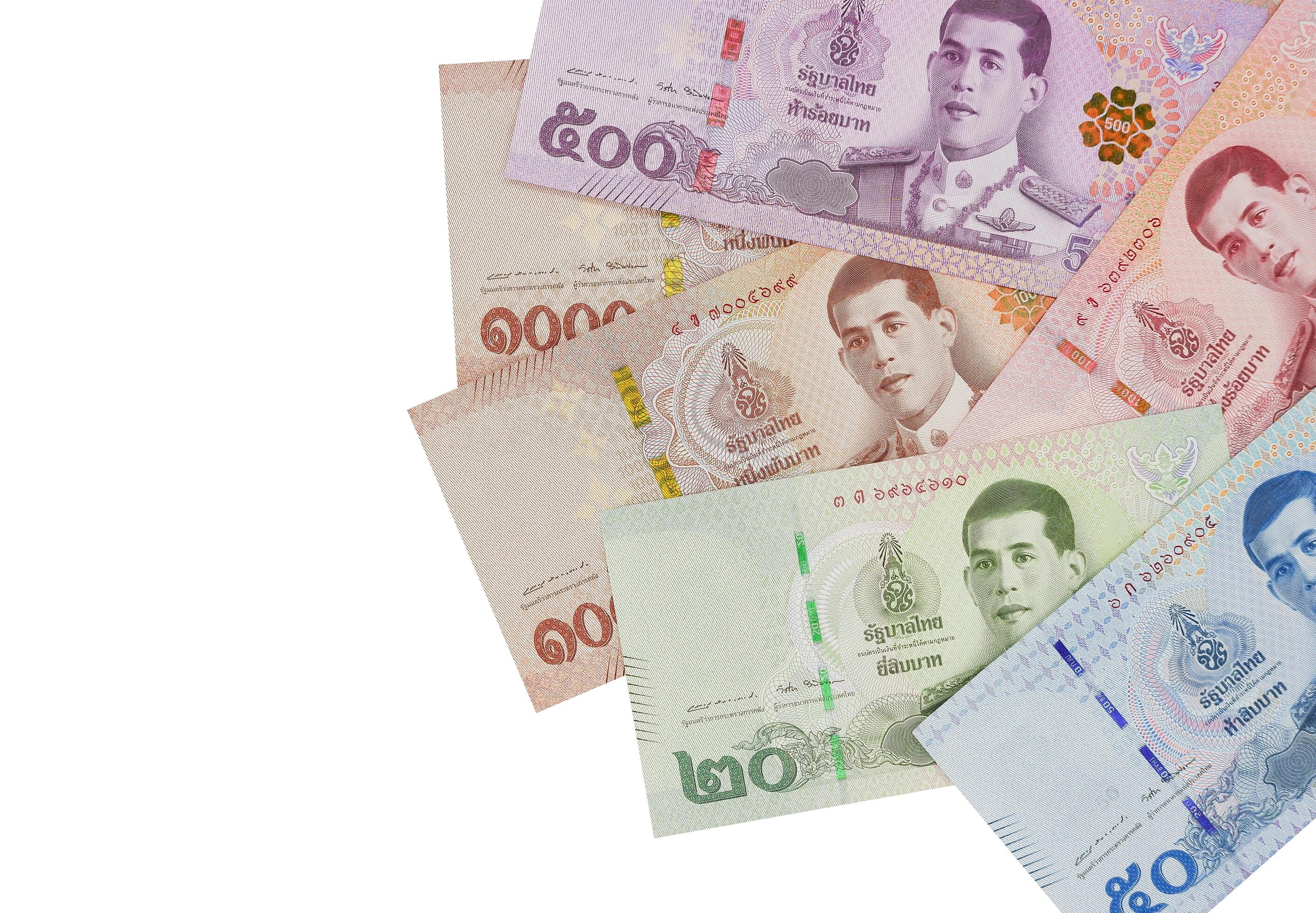 Pile of new Thai Baht banknotes, isolated on white background. Business and finance concept. Stock Free