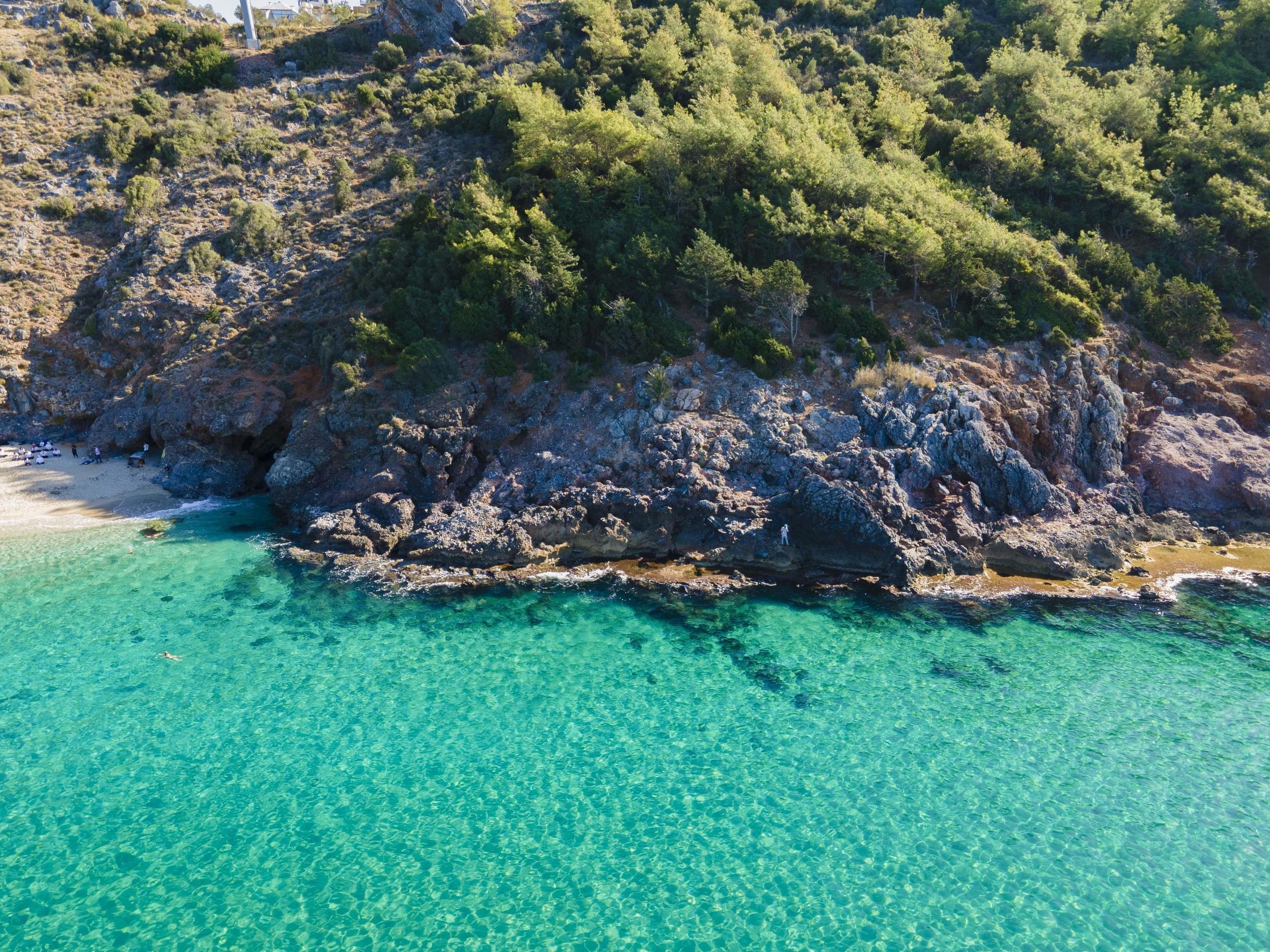 sea and rocky from the air. bird’s eye view over the blue sea Stock Free