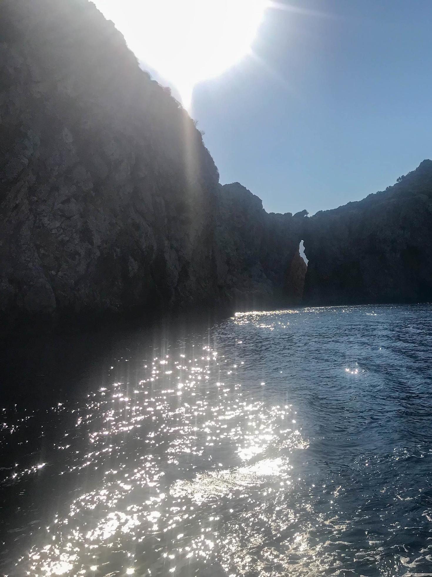 View of mountains and water in the sea and ocean in nature on a very sunny day. Landscape Stock Free