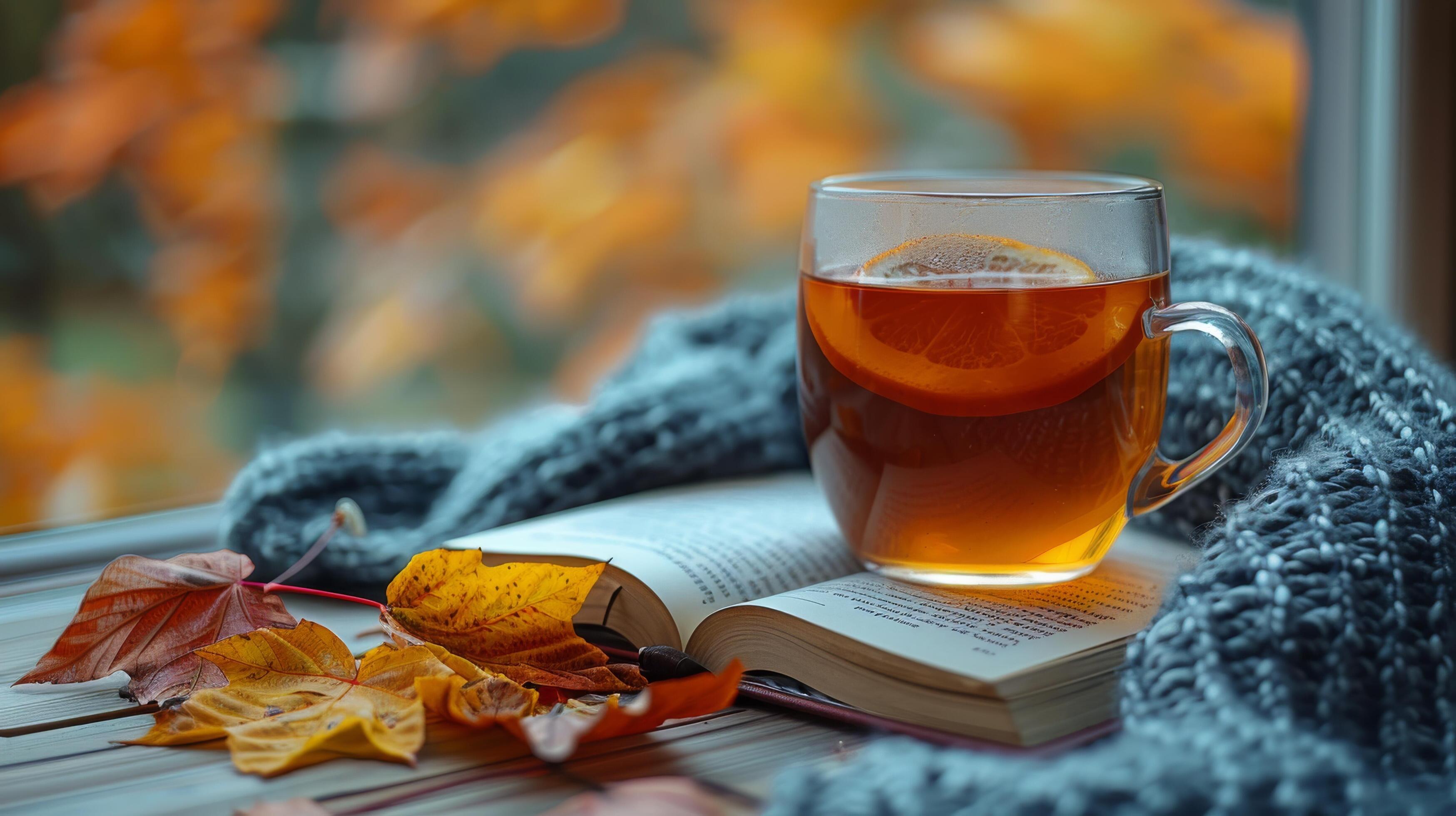 A Cup of Tea and a Book on a Wooden Table Stock Free