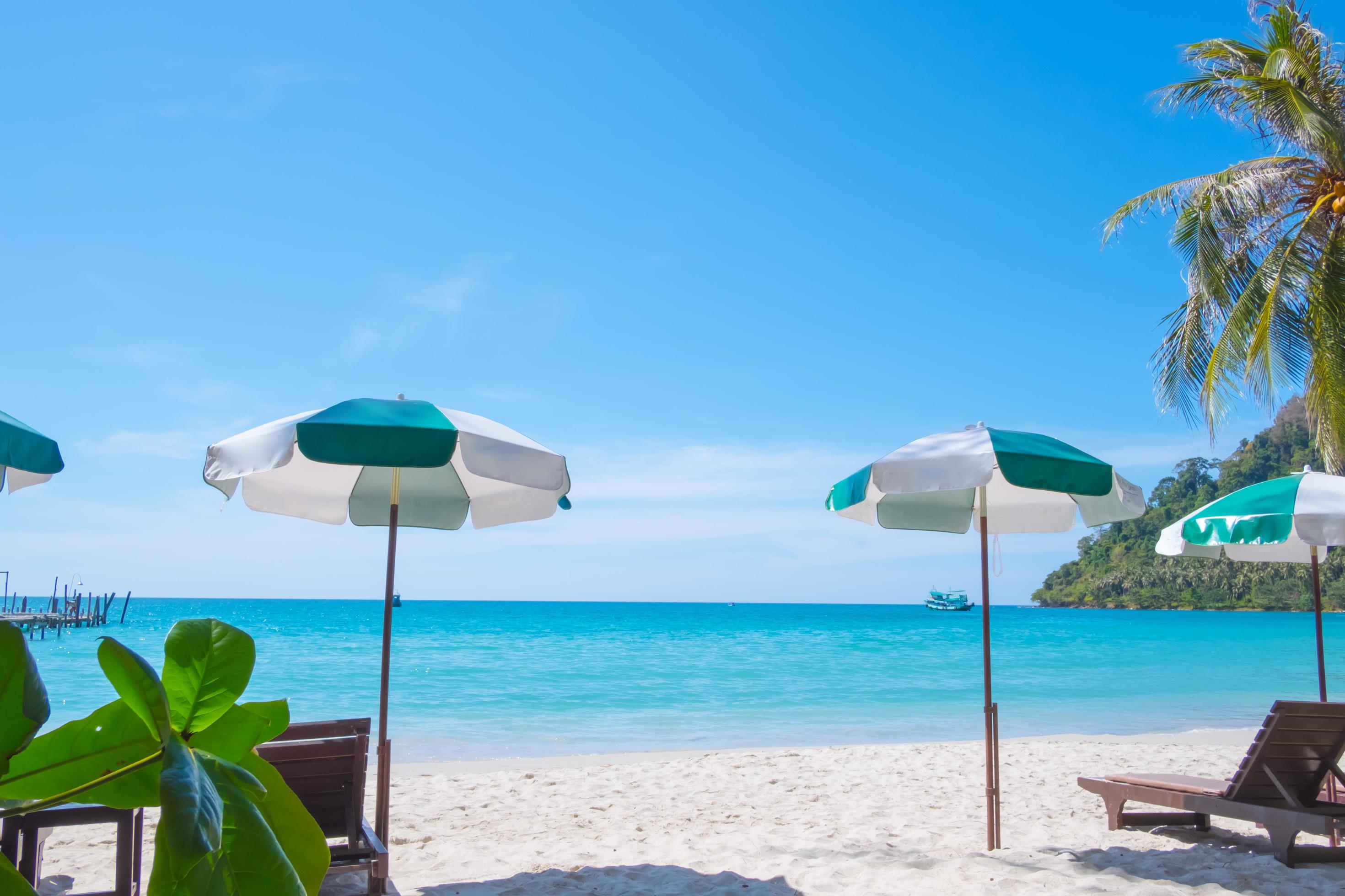 Tropical beach background as summer landscape with Beach chairs and beautiful sea view Stock Free