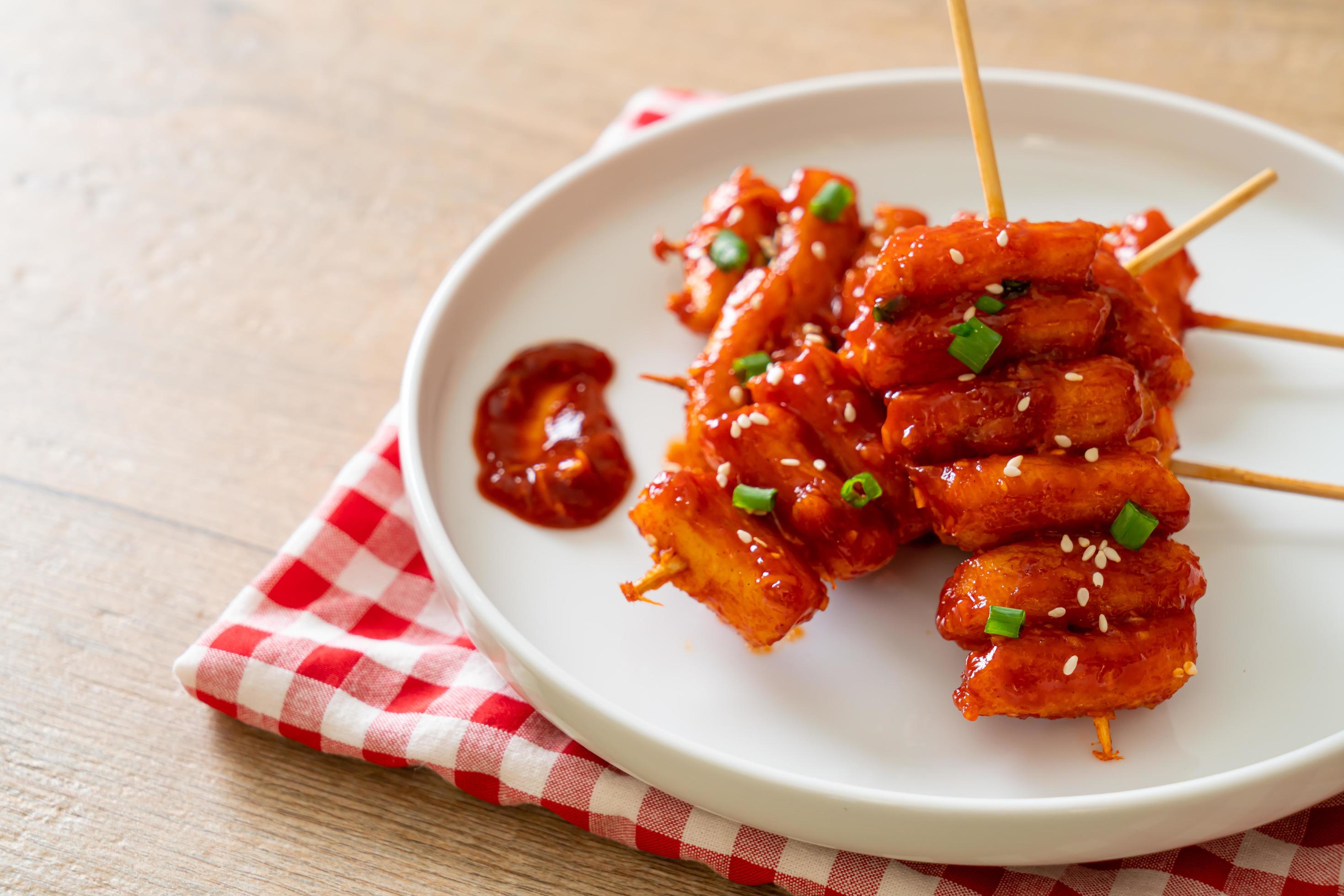 Deep-fried Korean rice cake, or Tteokbokki, skewered with spicy sauce – Korean food style Stock Free