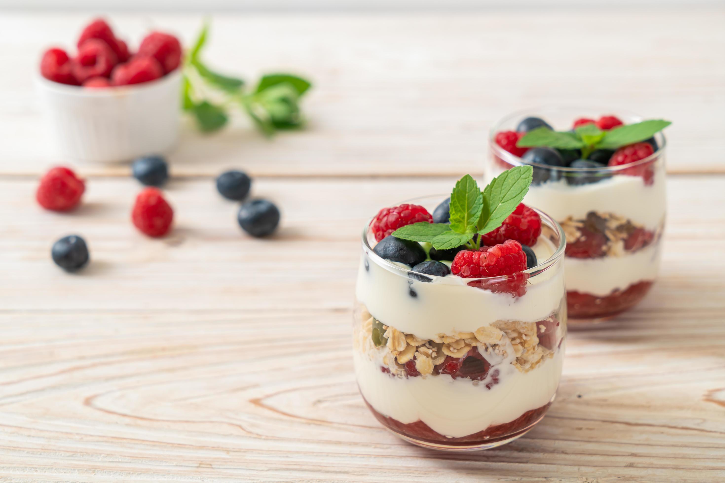 Homemade raspberry and blueberry with yogurt and granola – healthy food style Stock Free