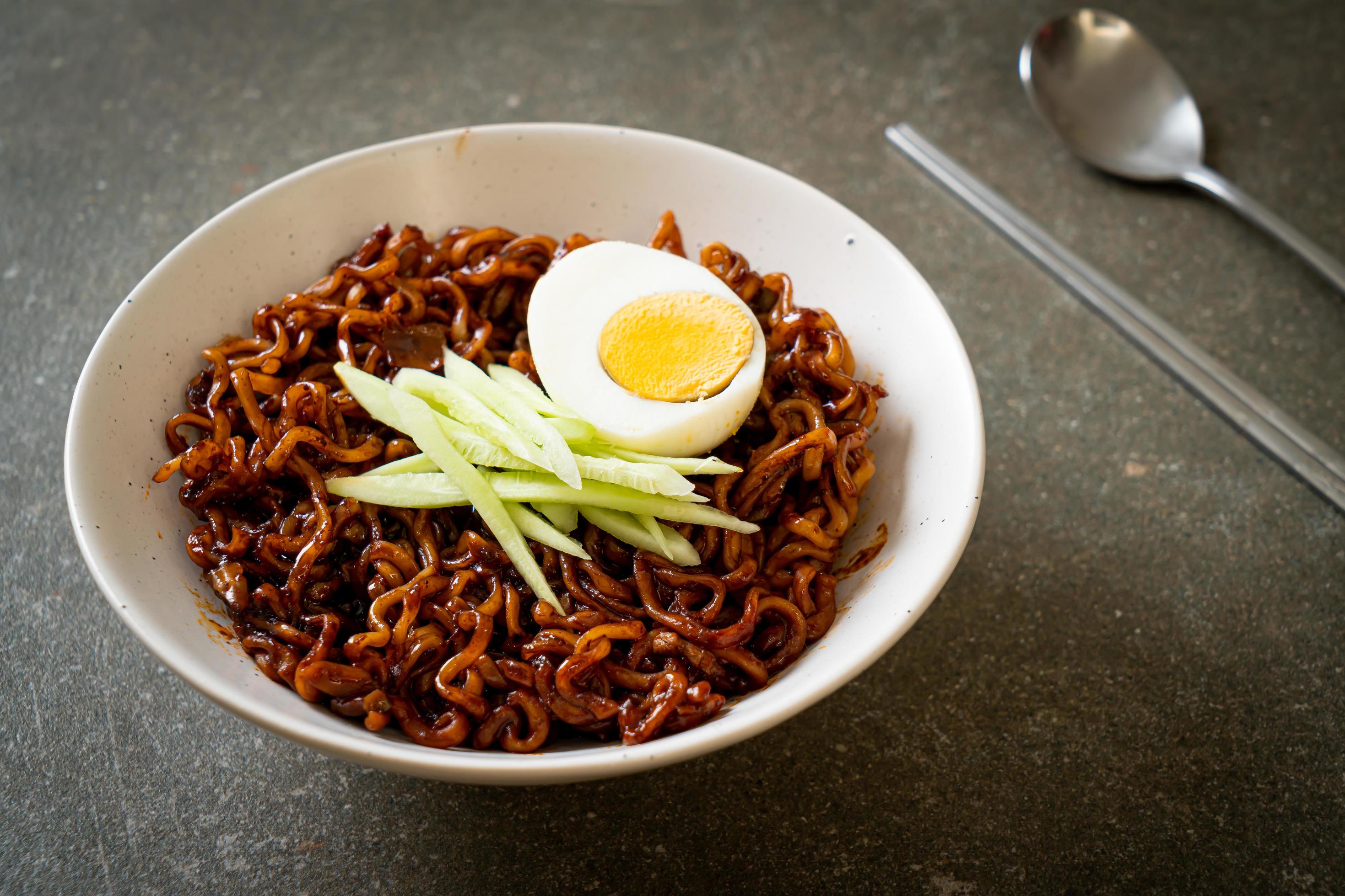 Korean instant noodle with black bean sauce topped with cucumber and boiled egg, Jjajangmyeon – Korean food style Stock Free