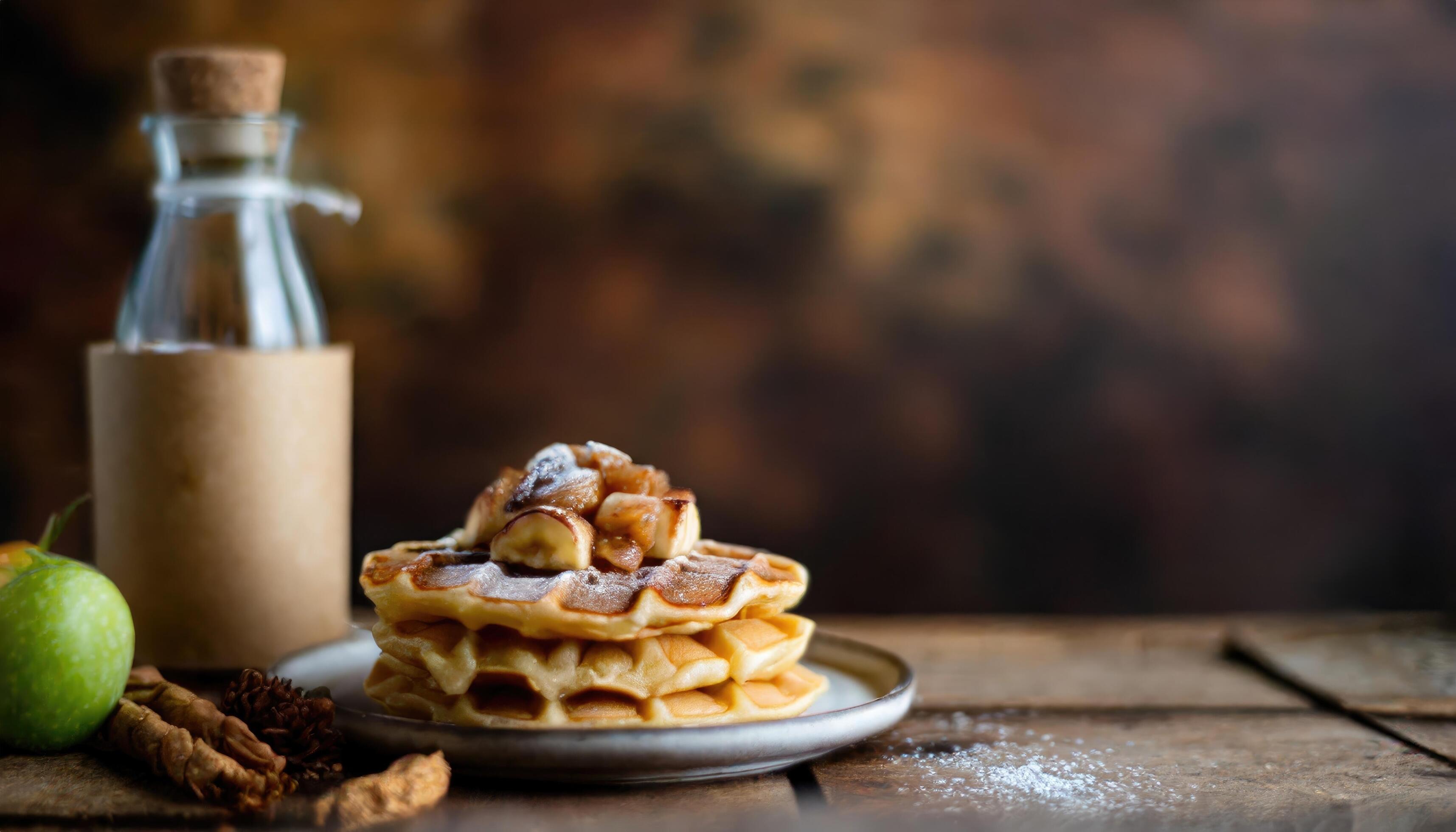 Copy Space image of Delicious viennese waffles with maple syrup drizzle and blackberry on dark brown wood background. Stock Free