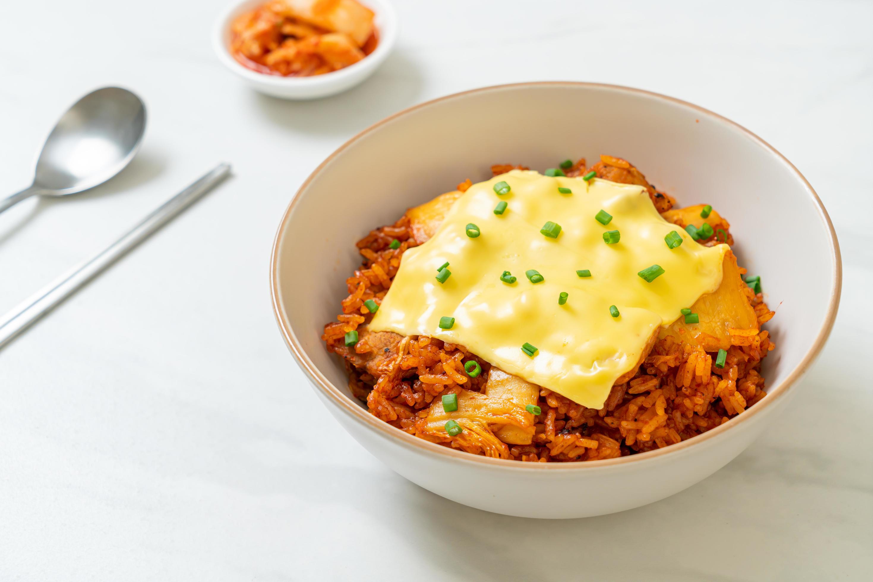 Kimchi fried rice with pork and topped cheese – Asian and fusion food style Stock Free