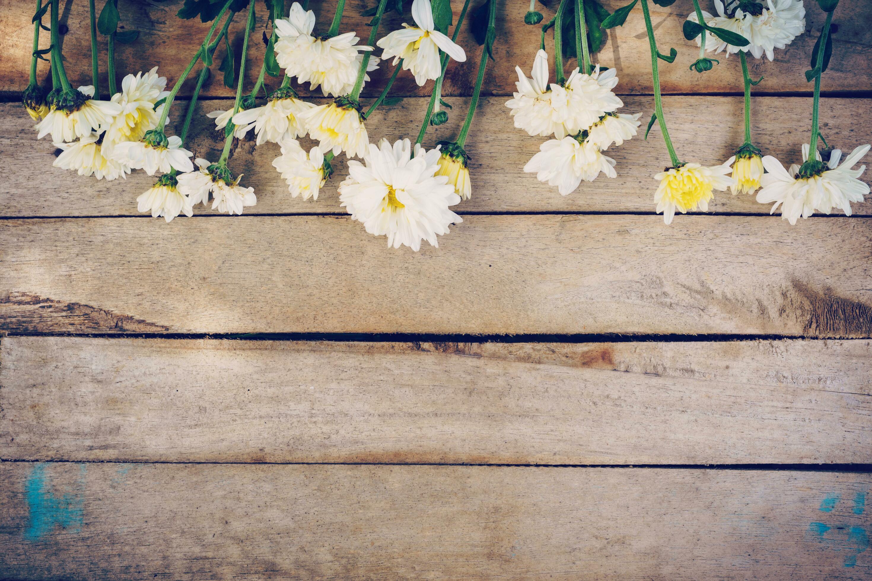 Flowers on old grunge wooden table texture and background with copy space. Stock Free