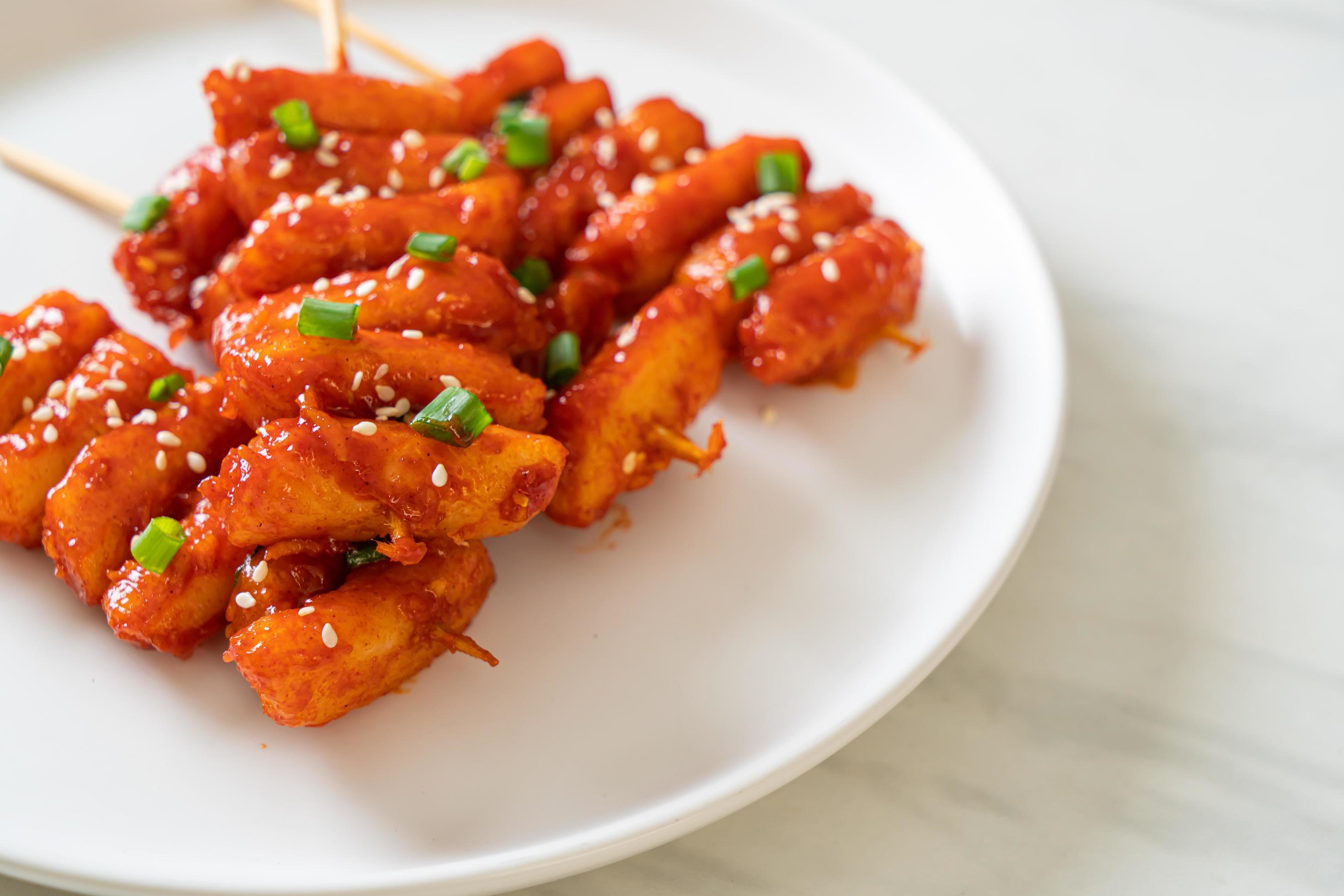 Deep-fried Korean rice cake, or Tteokbokki, with spicy sauce – Korean food style Stock Free