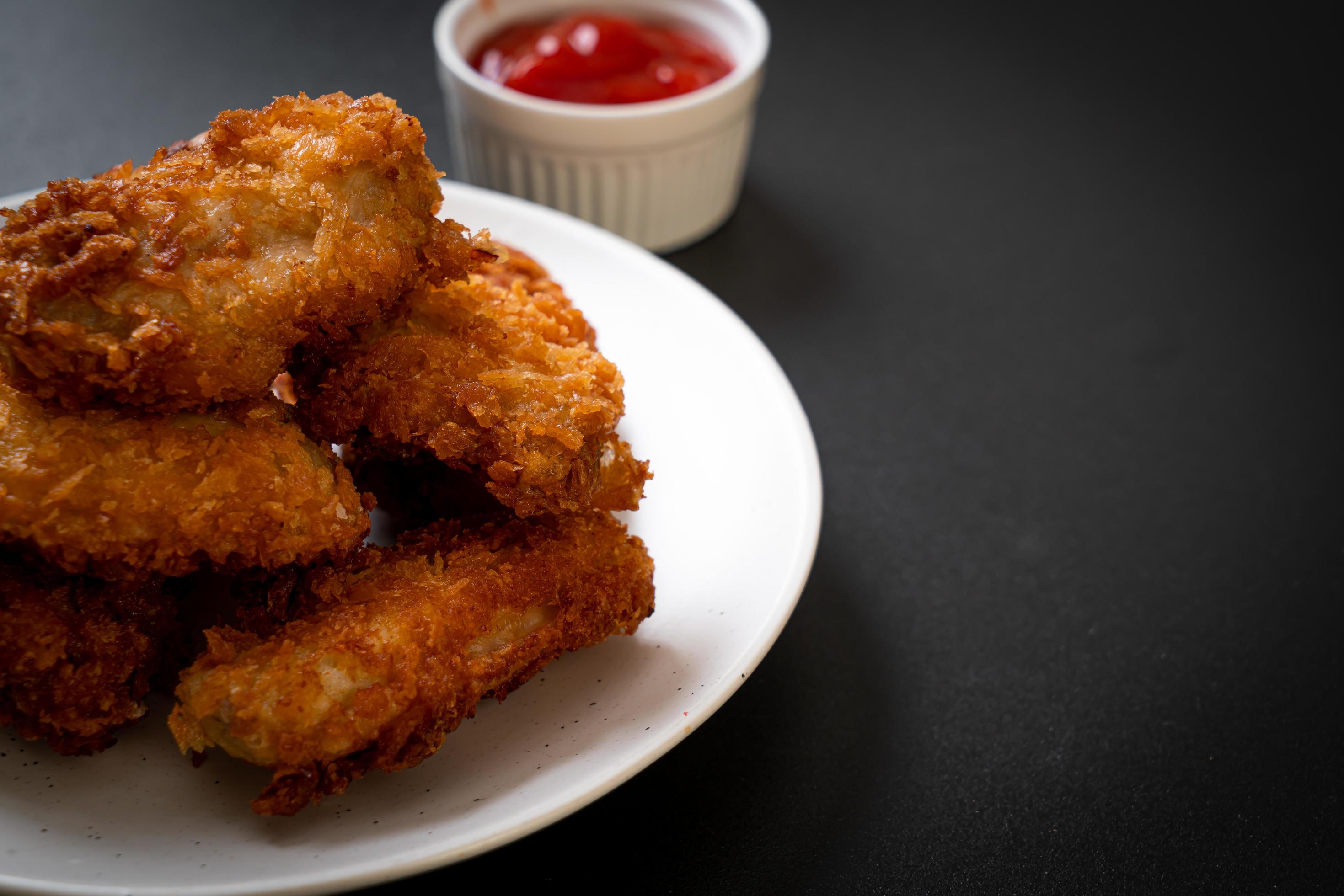 Fried chicken wings with ketchup – unhealthy food Stock Free